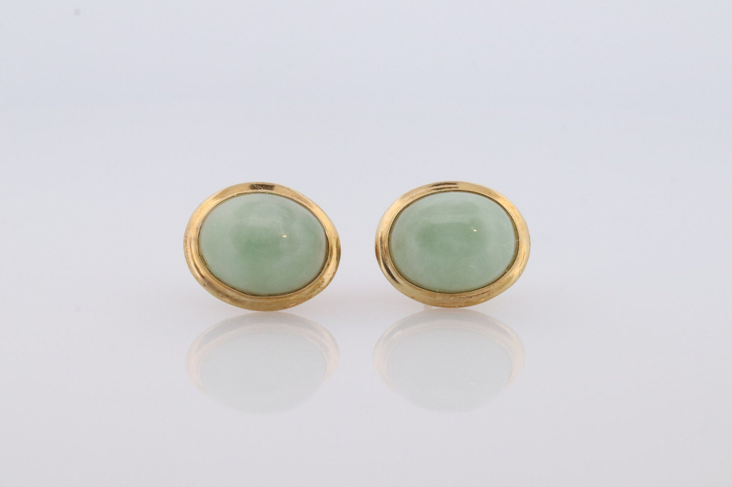 14k Jade stud earrings. Green Translucent Jade bezel set into 14k yellow gold. st(38)