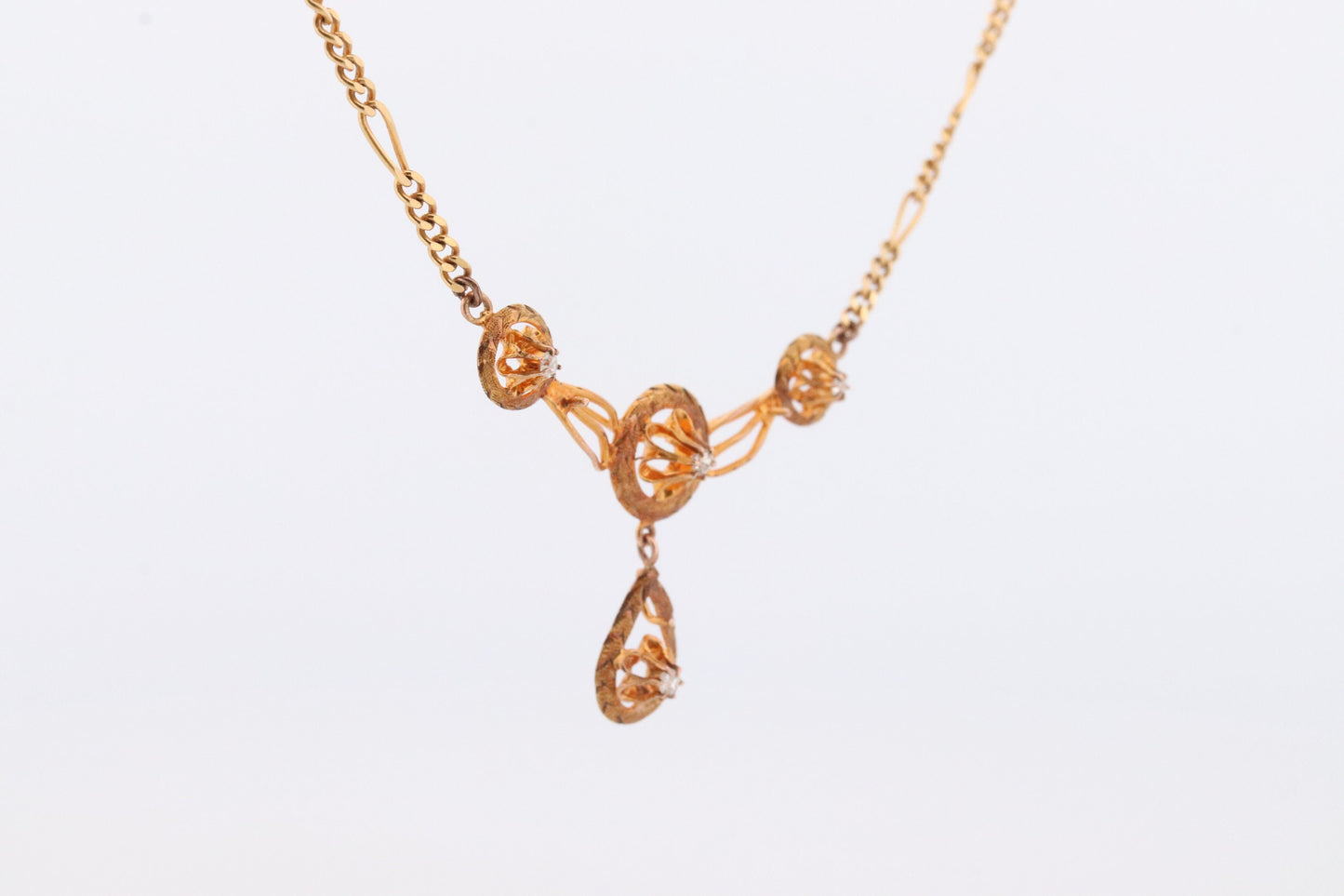 Diamond pendant lavaliere. 14k Gold with a diamond set buttercup necklace. Figaro Chain necklace. Balestra