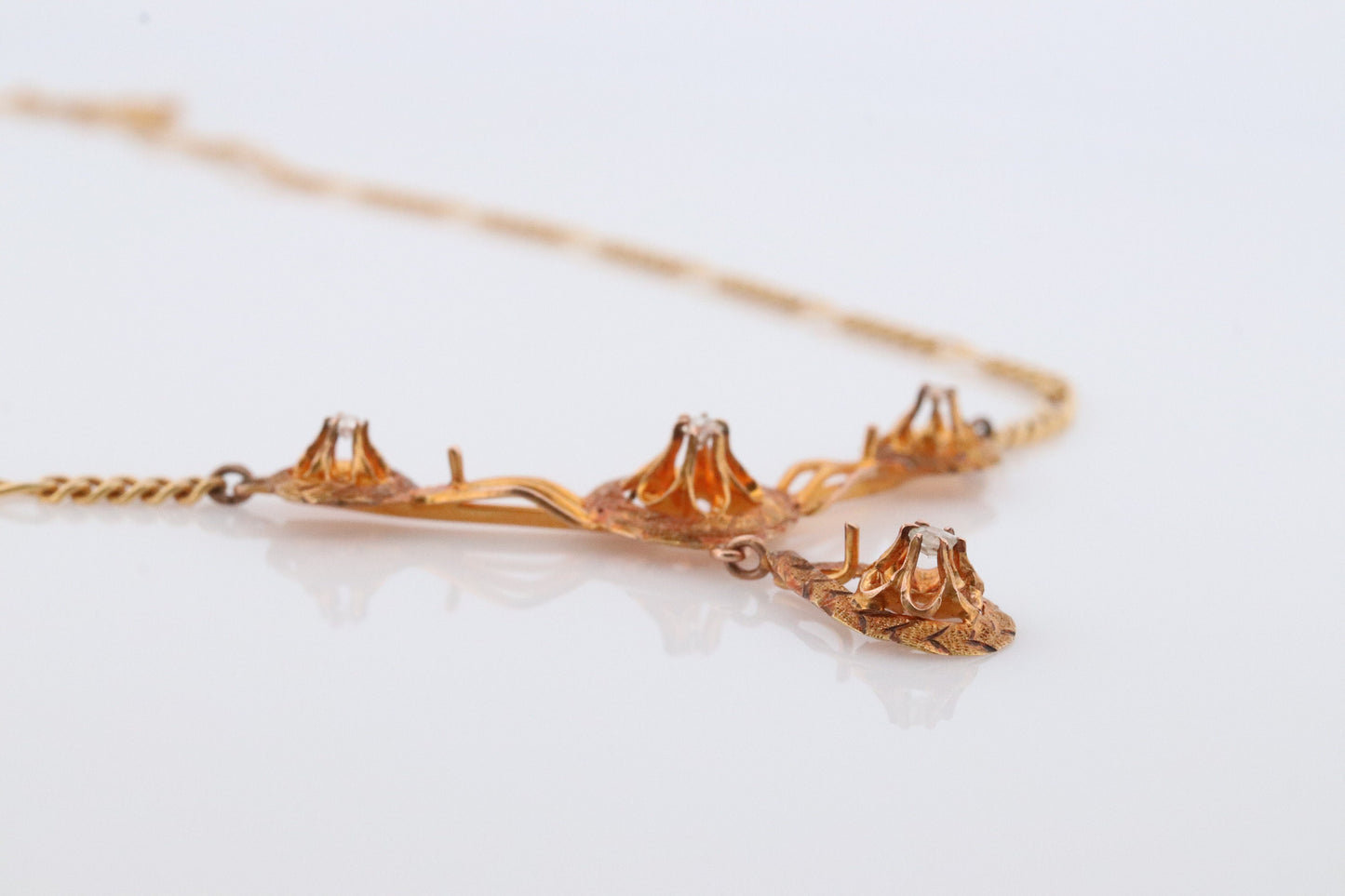 Diamond pendant lavaliere. 14k Gold with a diamond set buttercup necklace. Figaro Chain necklace. Balestra