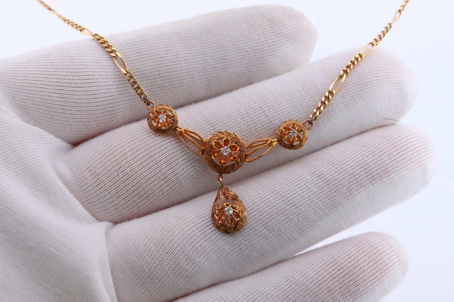 Diamond pendant lavaliere. 14k Gold with a diamond set buttercup necklace. Figaro Chain necklace. Balestra