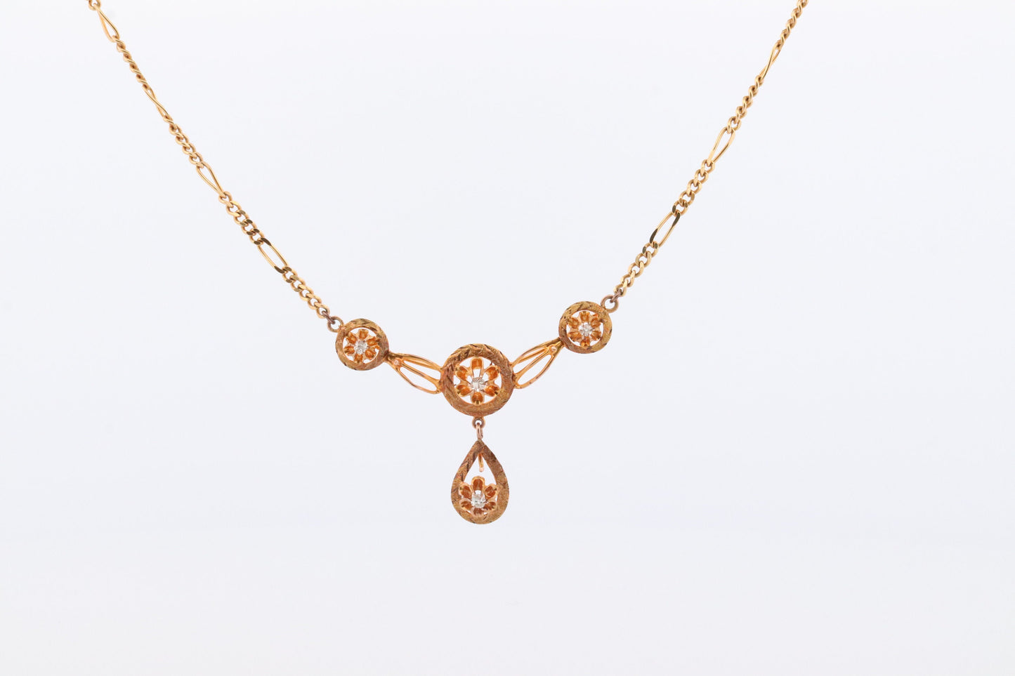 Diamond pendant lavaliere. 14k Gold with a diamond set buttercup necklace. Figaro Chain necklace. Balestra