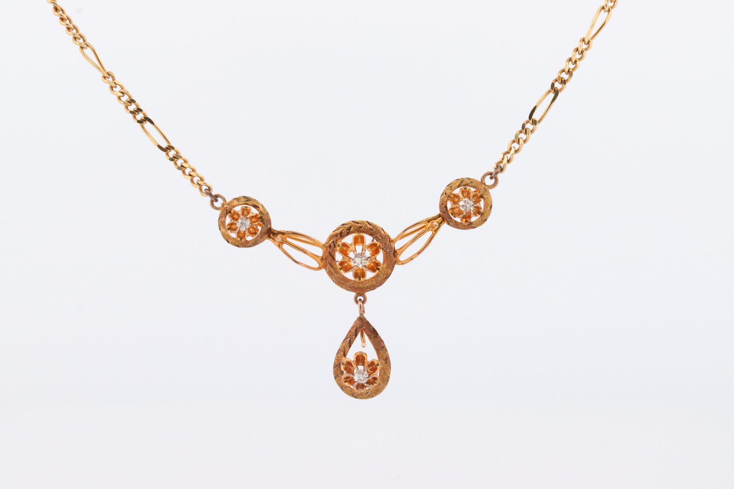 Diamond pendant lavaliere. 14k Gold with a diamond set buttercup necklace. Figaro Chain necklace. Balestra