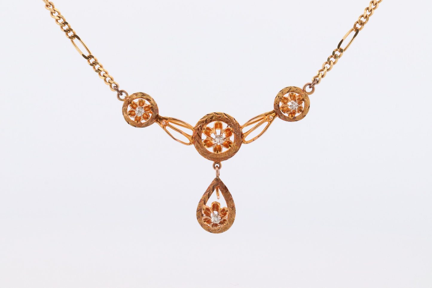 Diamond pendant lavaliere. 14k Gold with a diamond set buttercup necklace. Figaro Chain necklace. Balestra