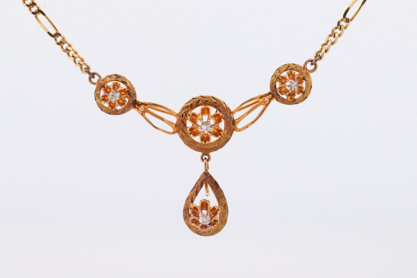 Diamond pendant lavaliere. 14k Gold with a diamond set buttercup necklace. Figaro Chain necklace. Balestra