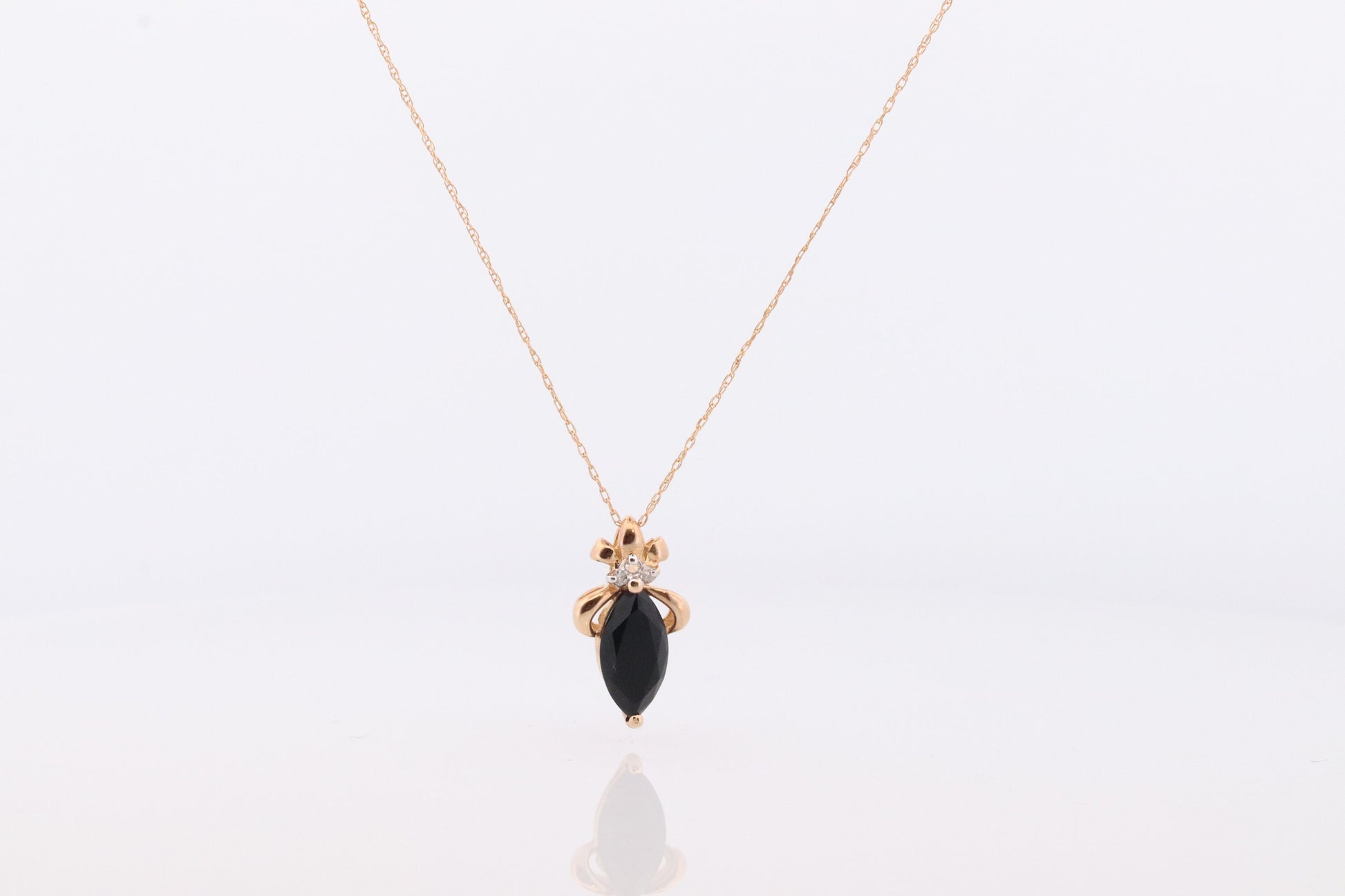 10k Onyx and Diamond Pendant. Marquise faceted Onyx and Diamond accent Pendant. Thin wheat chain necklace.