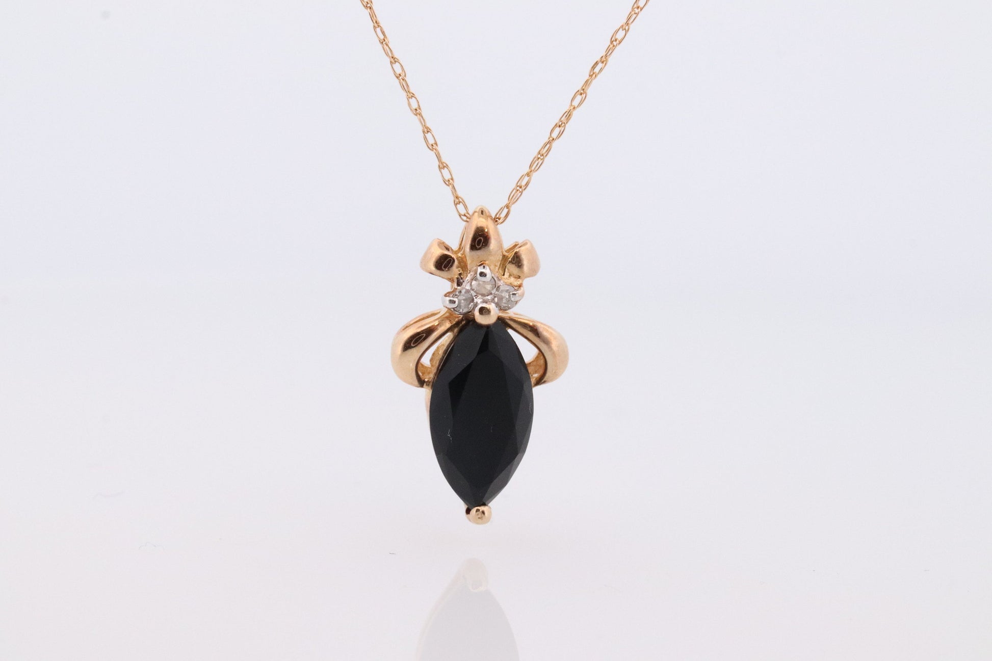 10k Onyx and Diamond Pendant. Marquise faceted Onyx and Diamond accent Pendant. Thin wheat chain necklace.