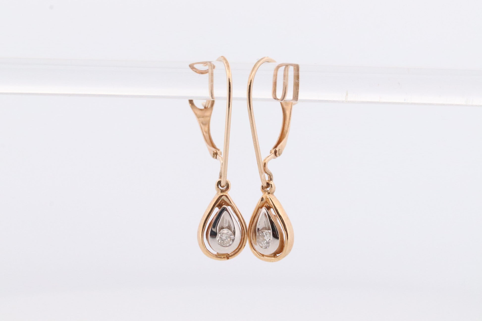 10k Diamond Dangle Earrings. Diamond Drop Teardrop Diamond Dangle earrings. Yellow and White Gold bezel set diamond.