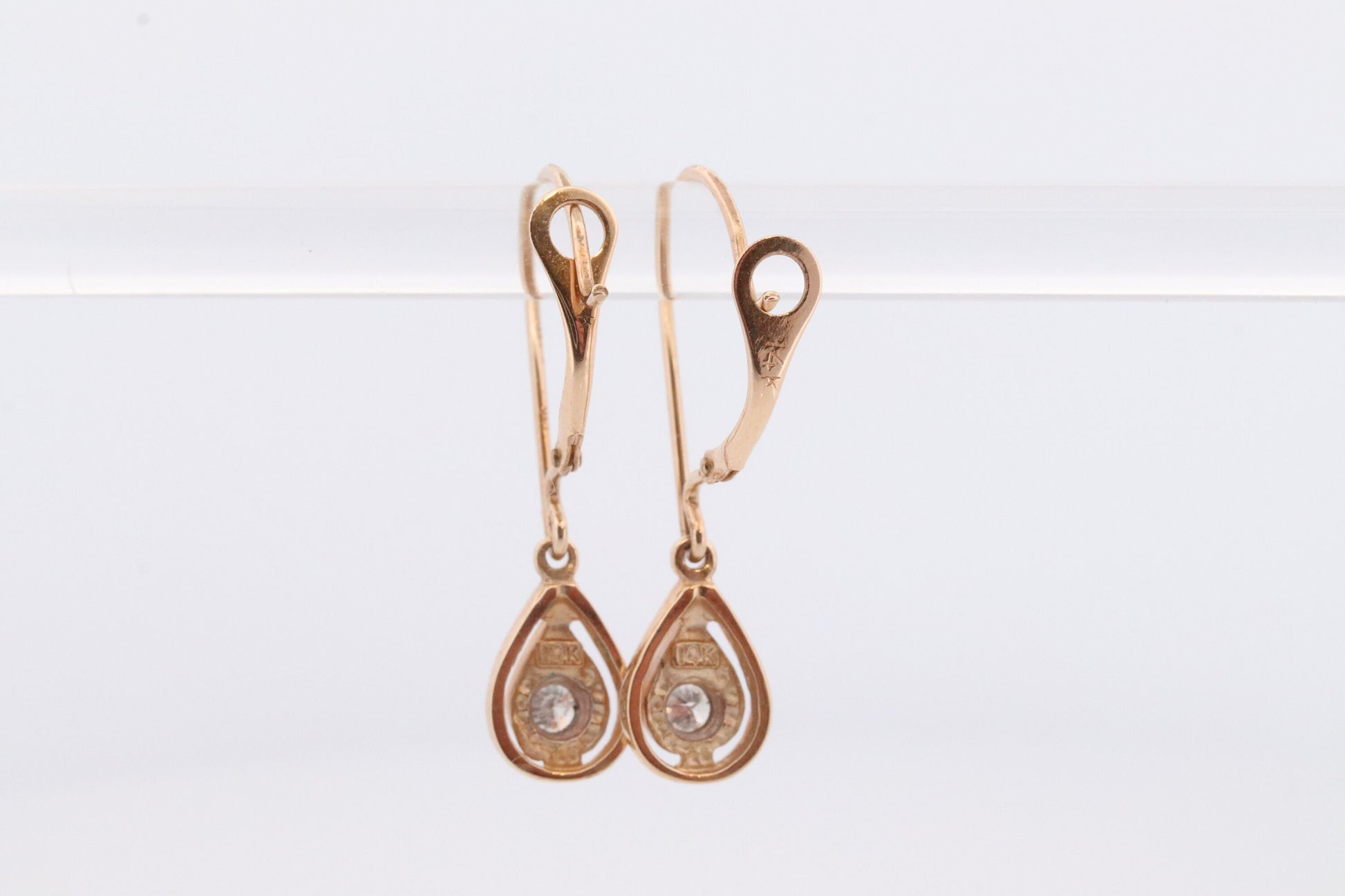 10k Diamond Dangle Earrings. Diamond Drop Teardrop Diamond Dangle earrings. Yellow and White Gold bezel set diamond.