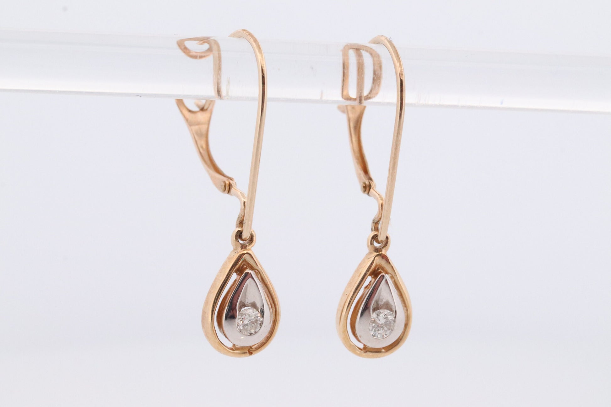 10k Diamond Dangle Earrings. Diamond Drop Teardrop Diamond Dangle earrings. Yellow and White Gold bezel set diamond.