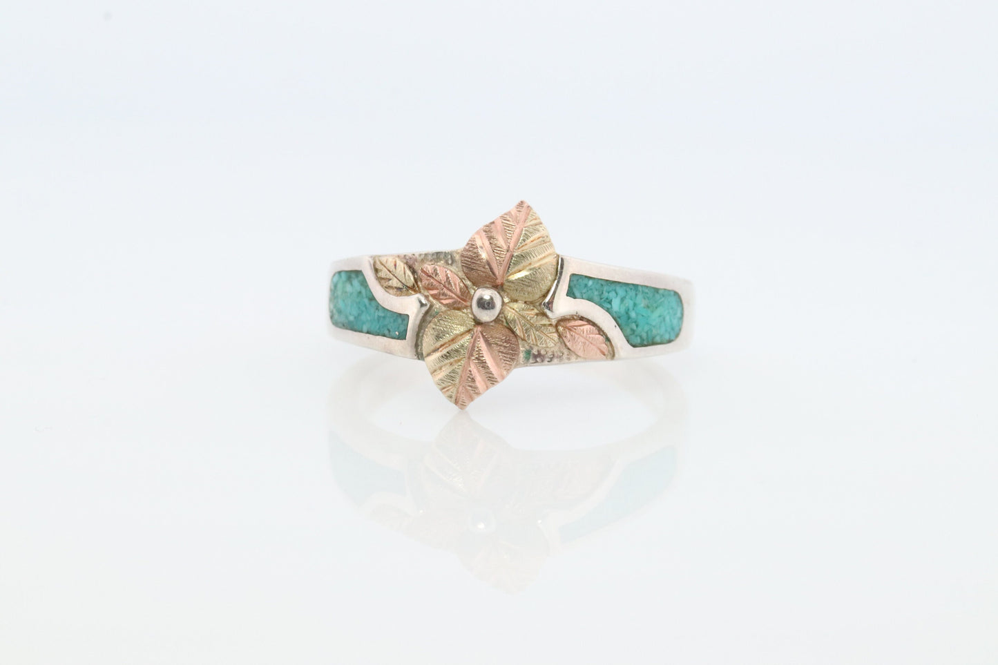 Black Hills Gold Turquoise Ring. Sterling Silver and 10k/12k Gold Leaves. Crushed Turquoise inlay.