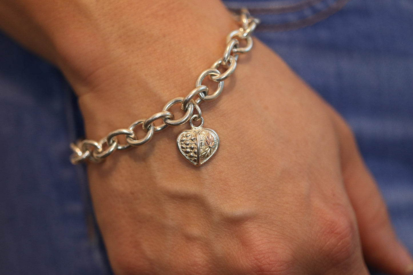 Black Hills Gold Bracelet. STERLING SILVER with 10k Multi-Tone Black Hills Gold. Large Cable with Heart charm.