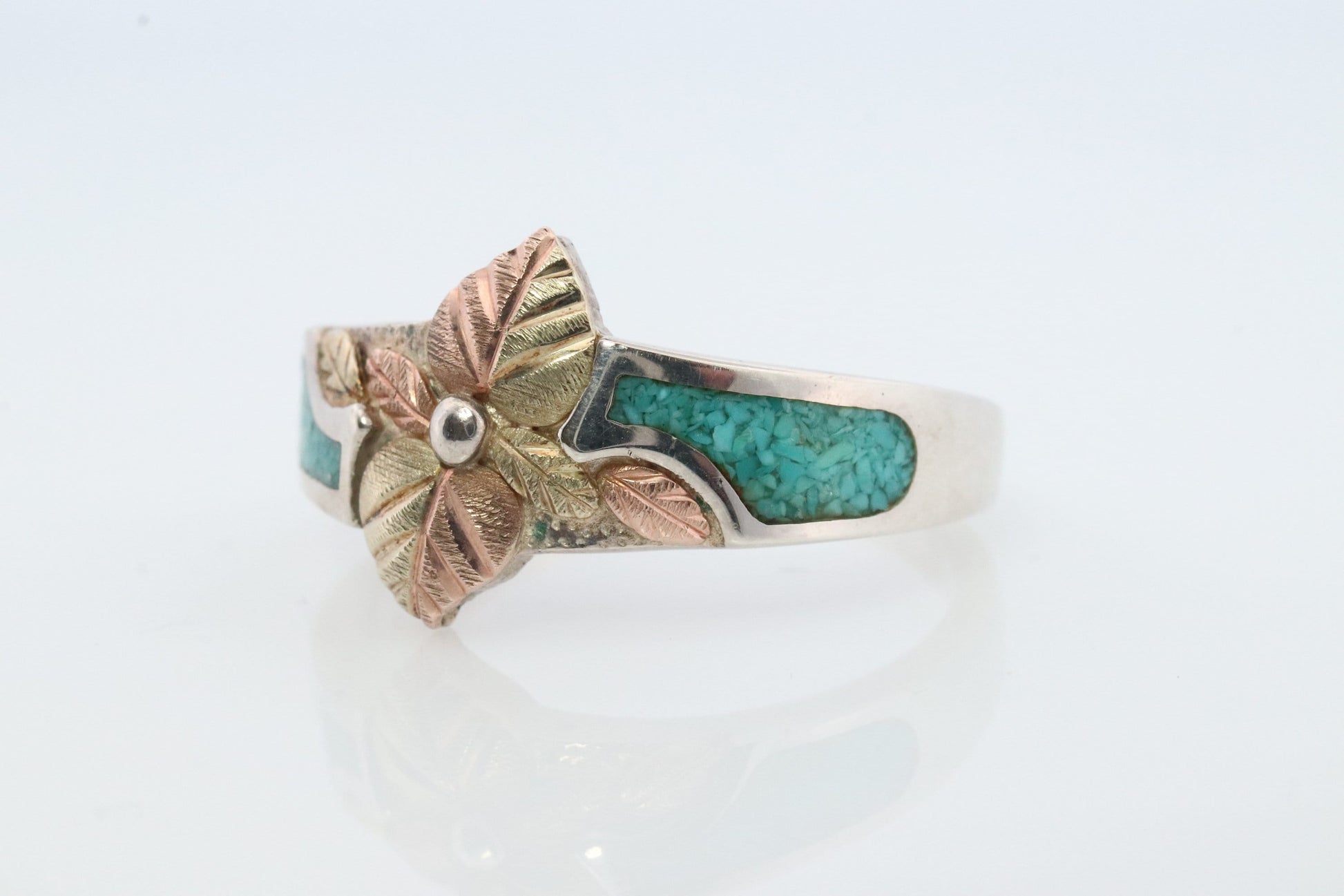 Black Hills Gold Turquoise Ring. Sterling Silver and 10k/12k Gold Leaves. Crushed Turquoise inlay.
