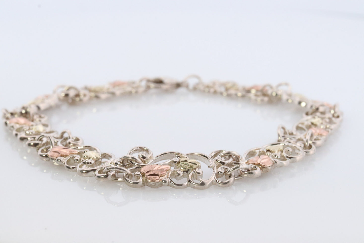 Black Hills Gold Bracelet. STERLING SILVER with 10k Multi-Tone Black Hills Gold Bracelet. Intricate Floral Vine Bracelet.