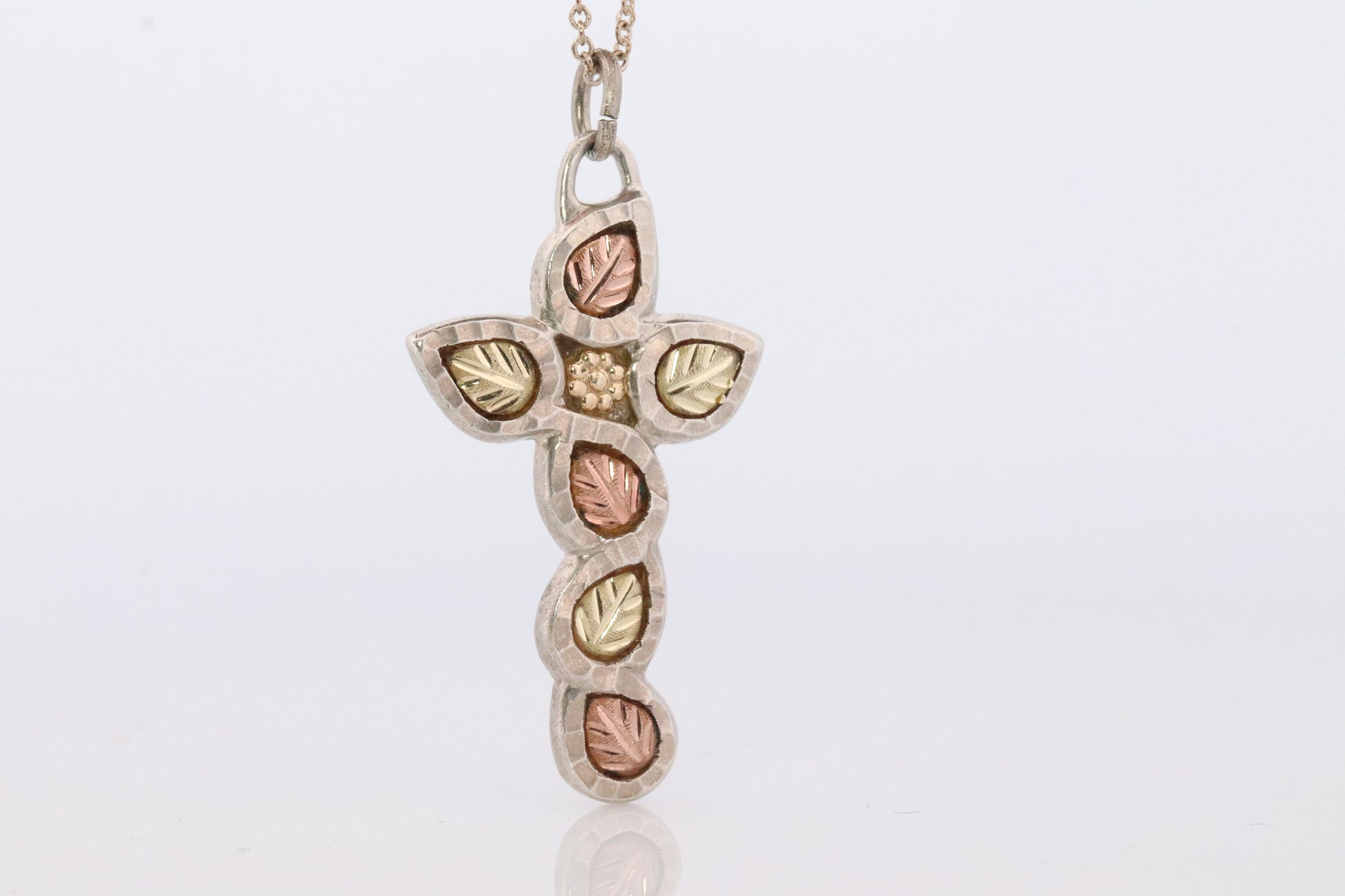 Black Hills Gold Cross Necklace. Sterling Silver with 10k/12k multi tone Black Hills Gold Crucifix Pendant.