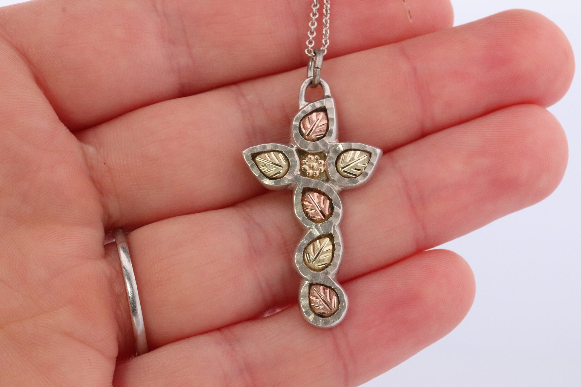 Black Hills Gold Cross Necklace. Sterling Silver with 10k/12k multi tone Black Hills Gold Crucifix Pendant.