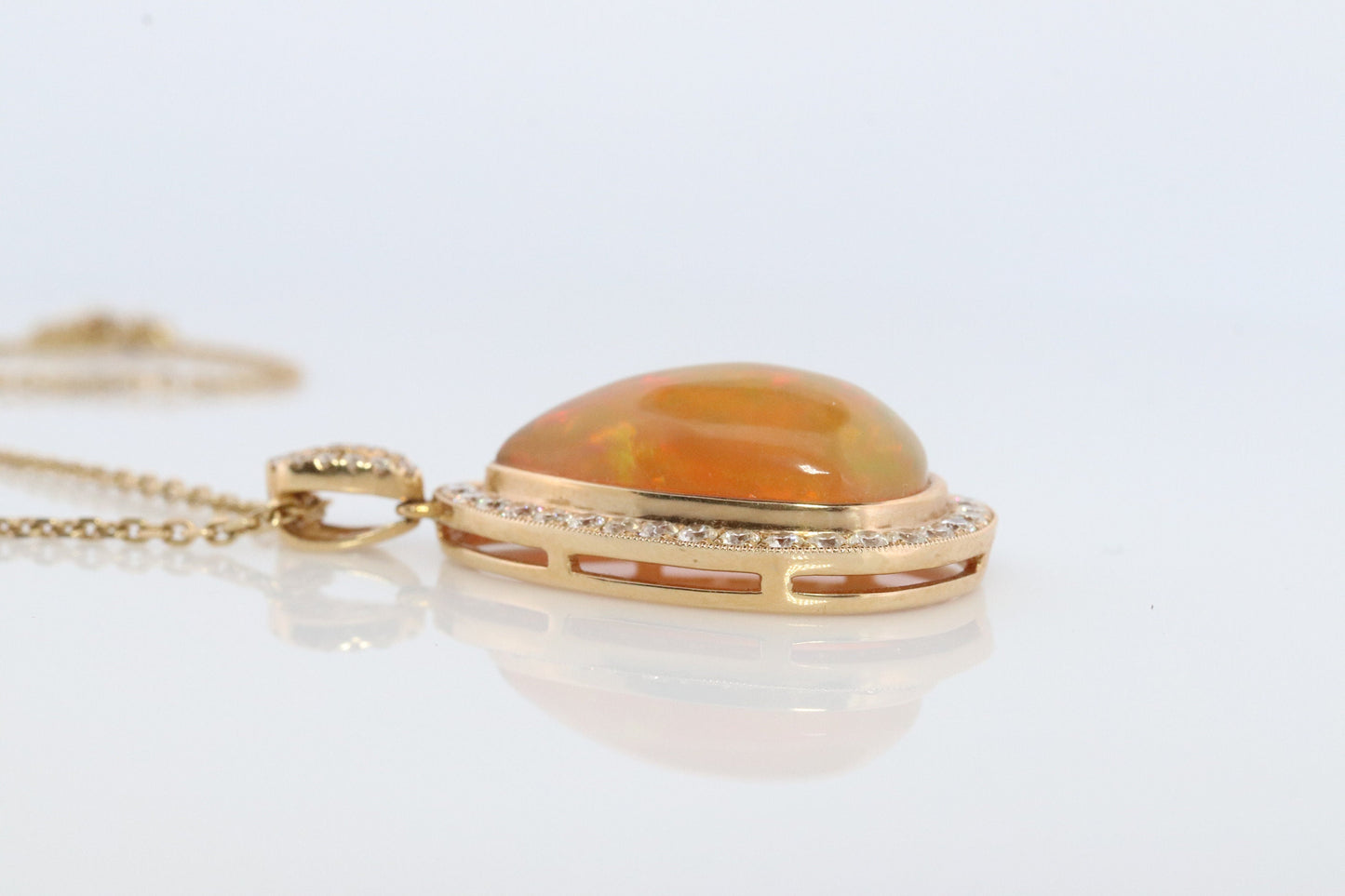 Opal and Diamond Halo 14k pendant. Large Natural Pendant Surrounded by Baguette and Round Diamonds. Pear Opal Cabochon. Appraised.