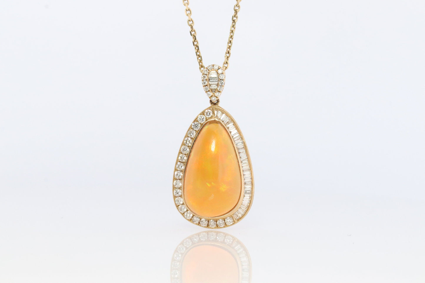 Opal and Diamond Halo 14k pendant. Large Natural Pendant Surrounded by Baguette and Round Diamonds. Pear Opal Cabochon. Appraised.