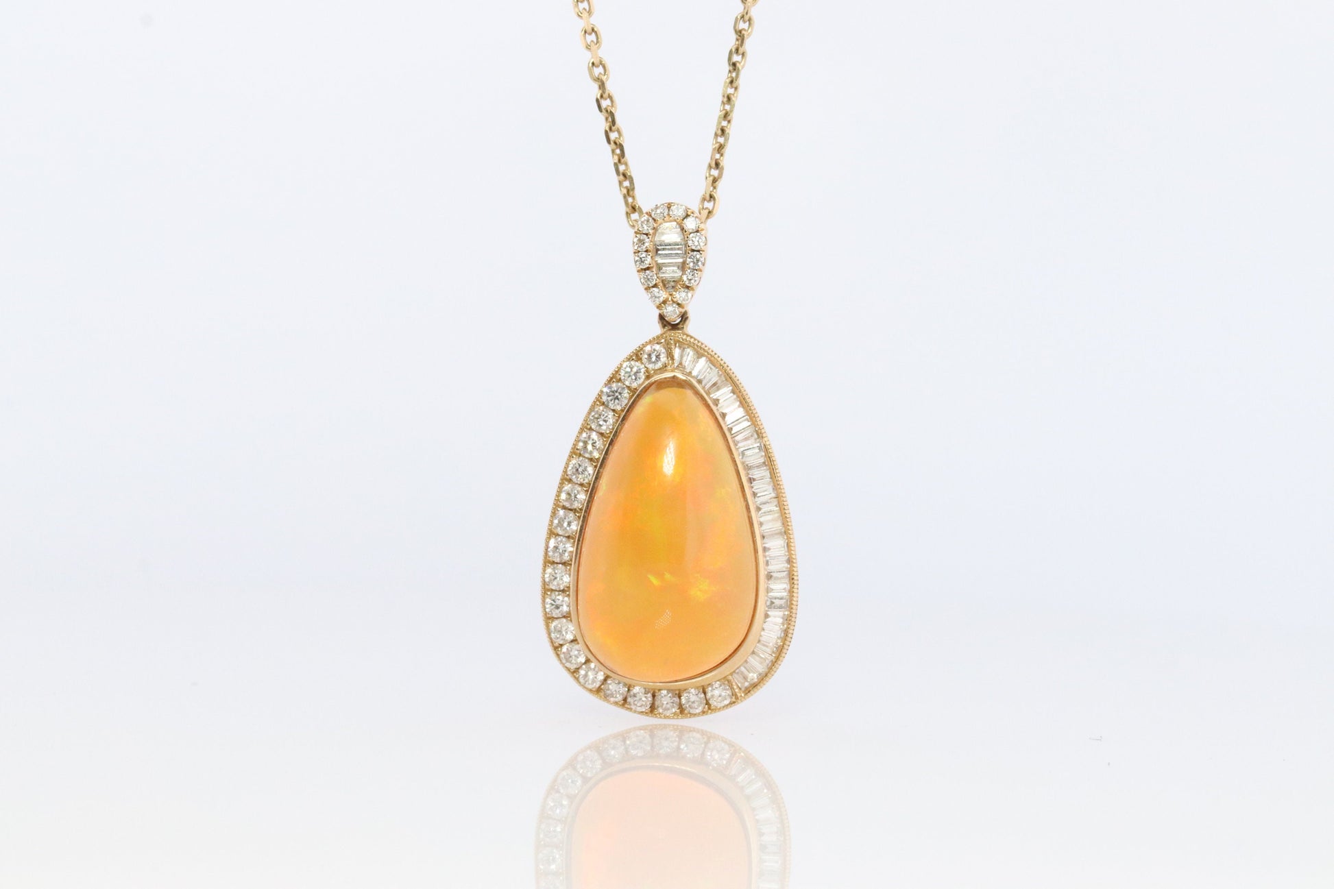 Opal and Diamond Halo 14k pendant. Large Natural Pendant Surrounded by Baguette and Round Diamonds. Pear Opal Cabochon. Appraised.