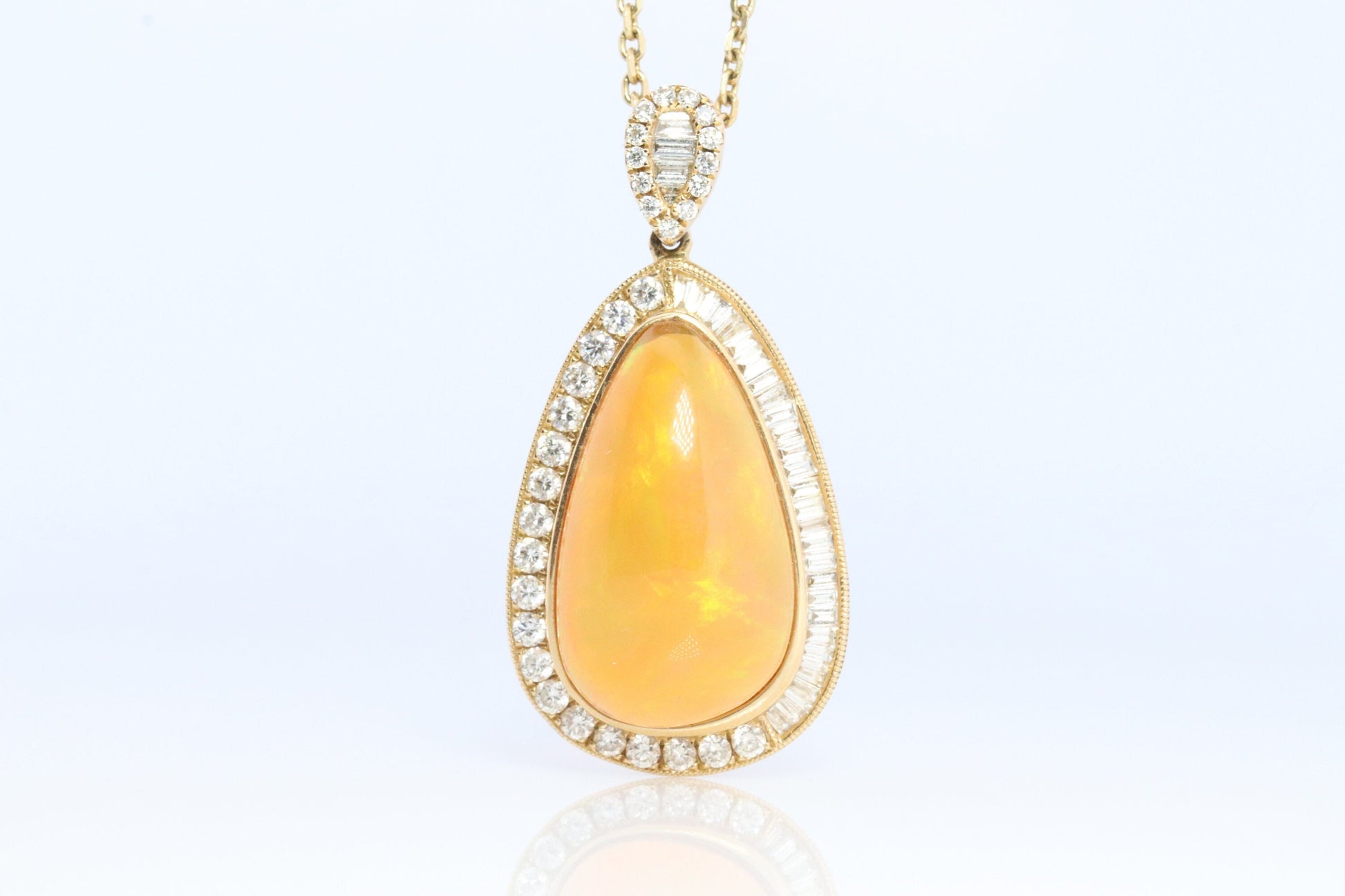 Opal and Diamond Halo 14k pendant. Large Natural Pendant Surrounded by Baguette and Round Diamonds. Pear Opal Cabochon. Appraised.