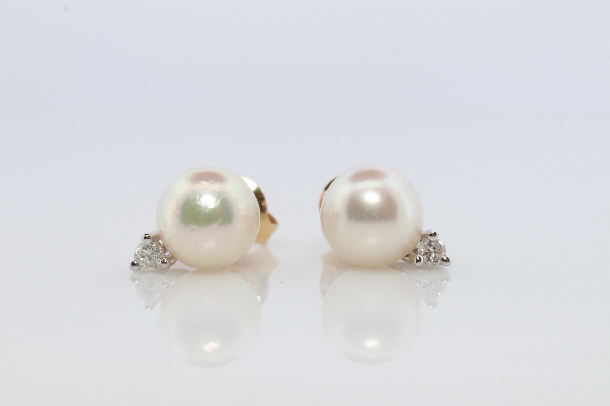 14k Pearl and Diamond stud earrings. Elegant and Dainty Pearl diamond studs.