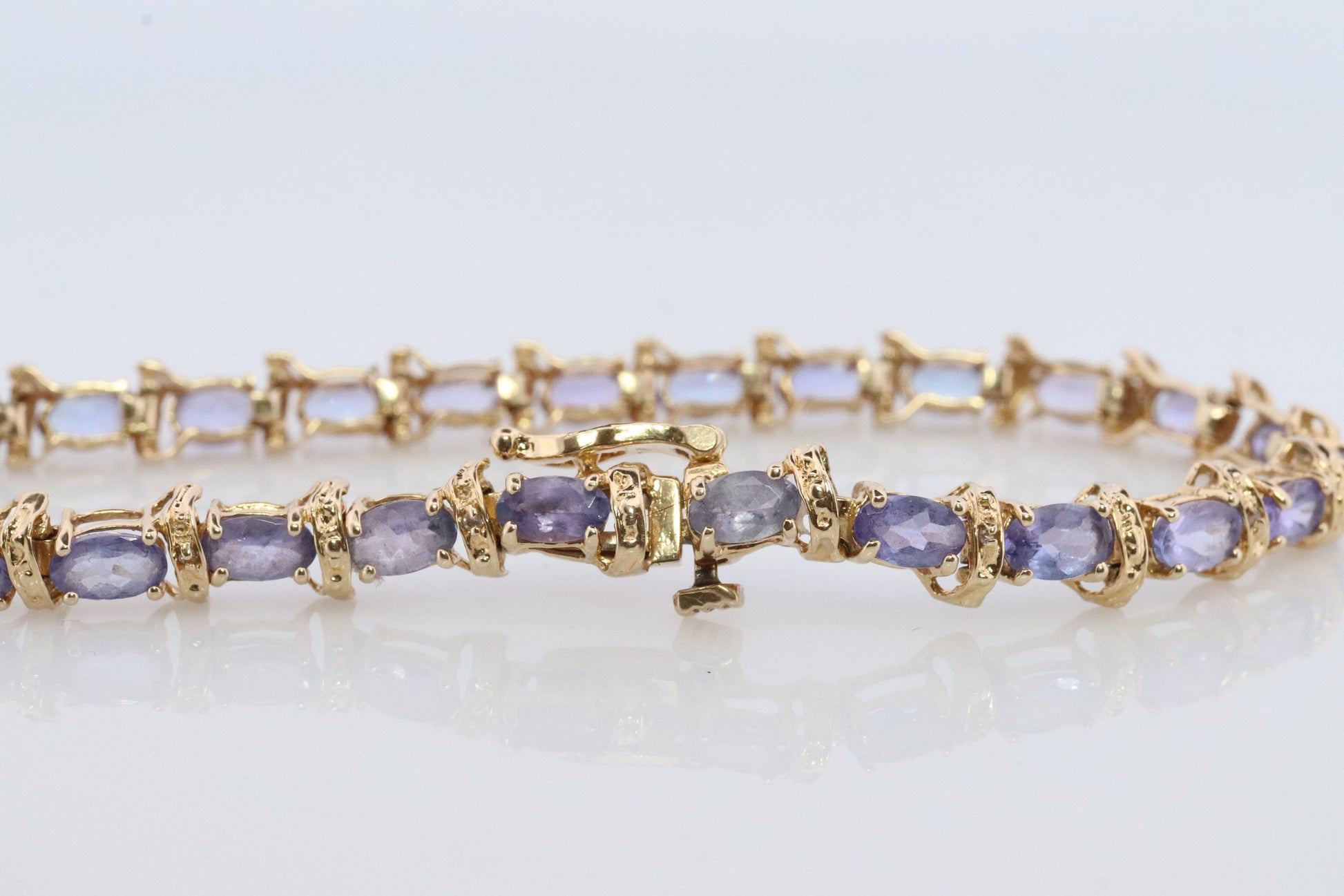 14k Tanzanite Tennis Bracelet. 14k Yellow Gold oval Tanzanite Bracelet. 14k Tanzanite alternating Bracelet.