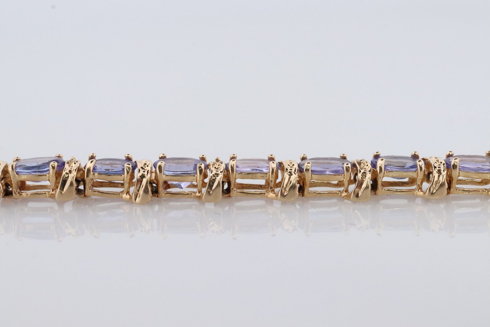 14k Tanzanite Tennis Bracelet. 14k Yellow Gold oval Tanzanite Bracelet. 14k Tanzanite alternating Bracelet.