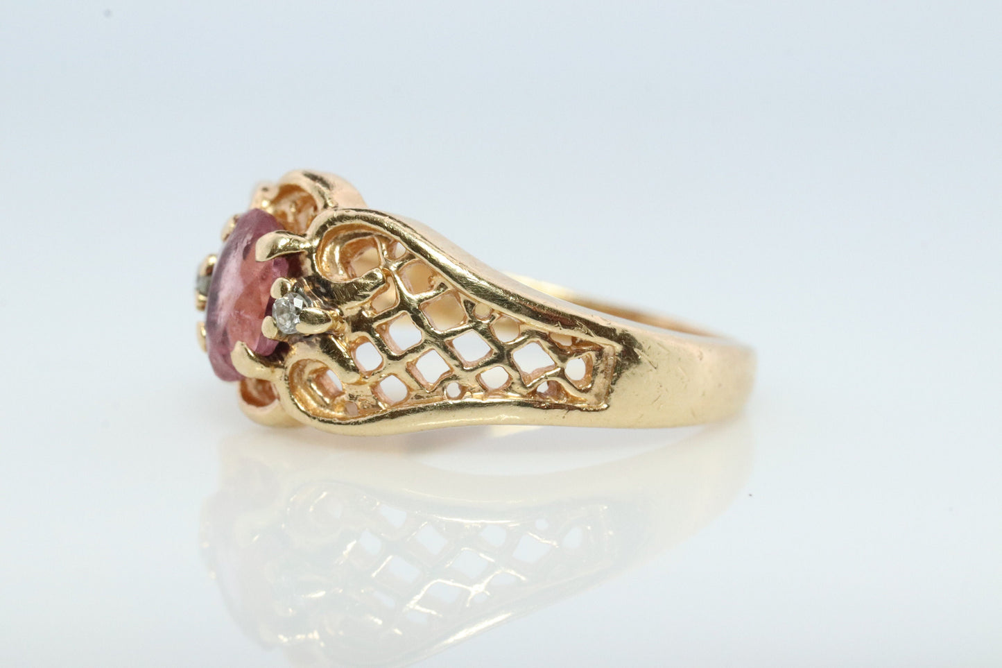 14k Pink Tourmaline Ring. prong set OVAL Tourmaline solitaire with diamond accents.