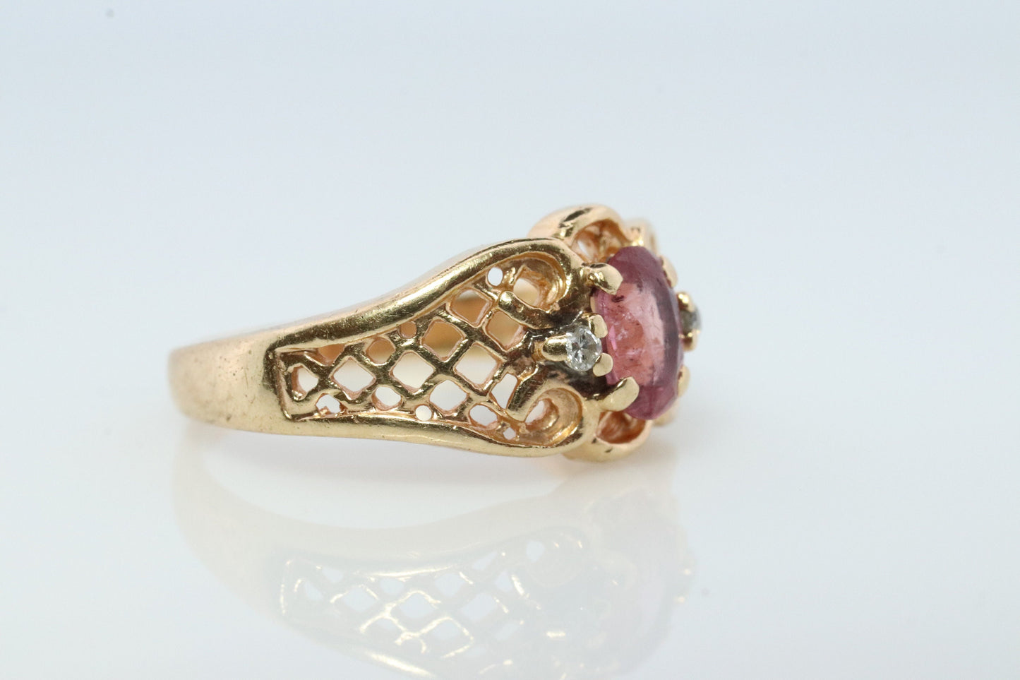 14k Pink Tourmaline Ring. prong set OVAL Tourmaline solitaire with diamond accents.