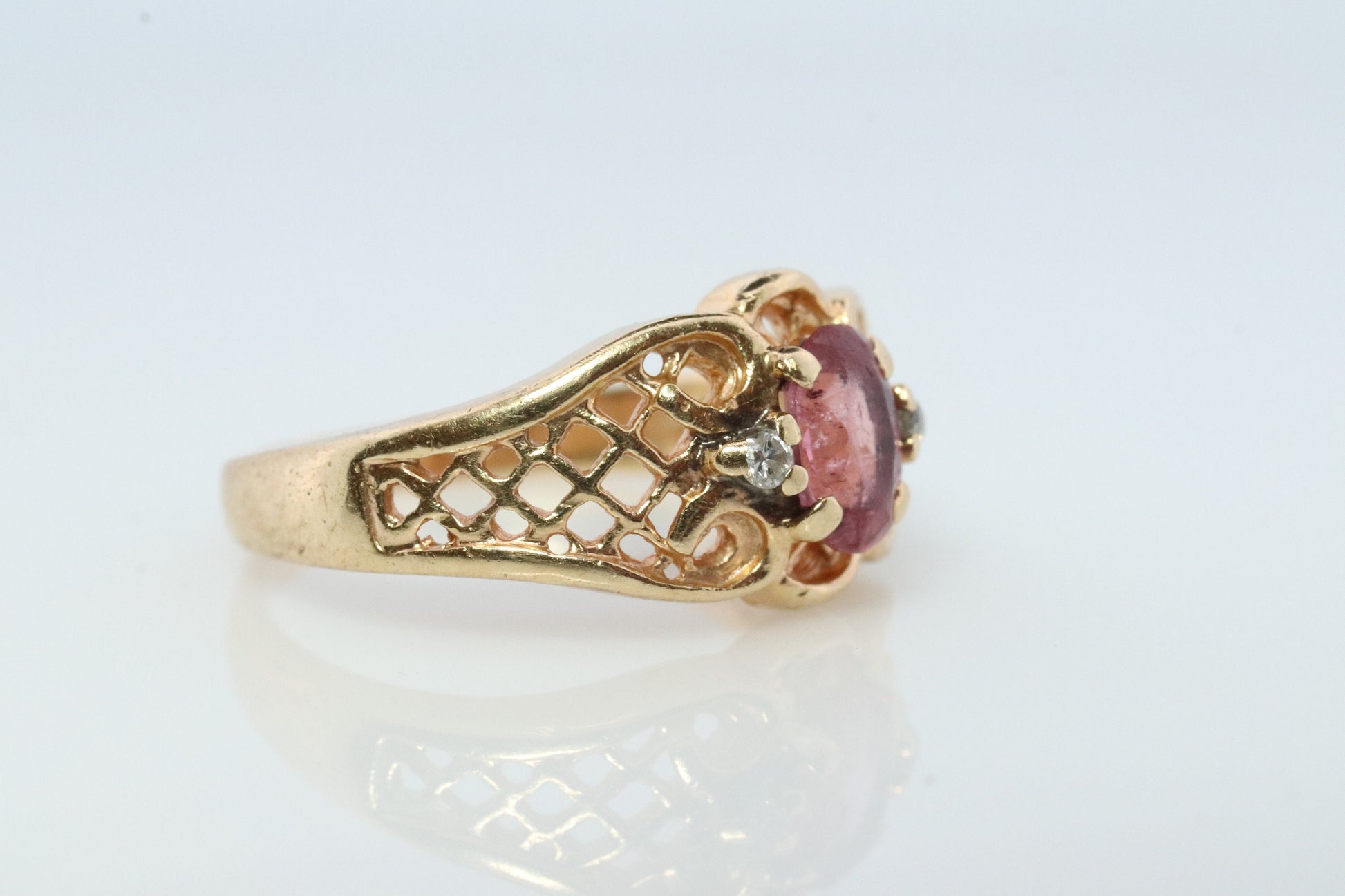 14k Pink Tourmaline Ring. prong set OVAL Tourmaline solitaire with diamond accents.
