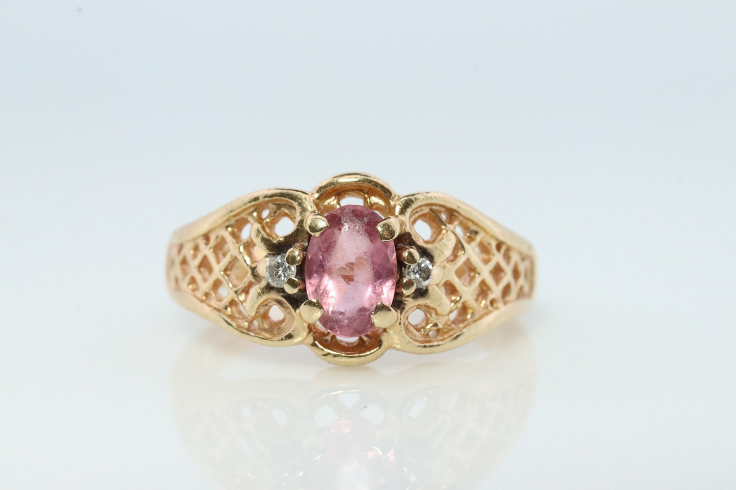 14k Pink Tourmaline Ring. prong set OVAL Tourmaline solitaire with diamond accents.