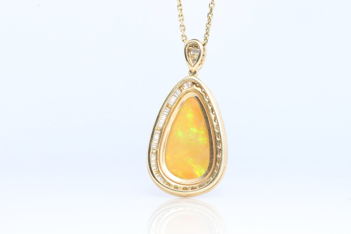 Opal and Diamond Halo 14k pendant. Large Natural Pendant Surrounded by Baguette and Round Diamonds. Pear Opal Cabochon. Appraised.