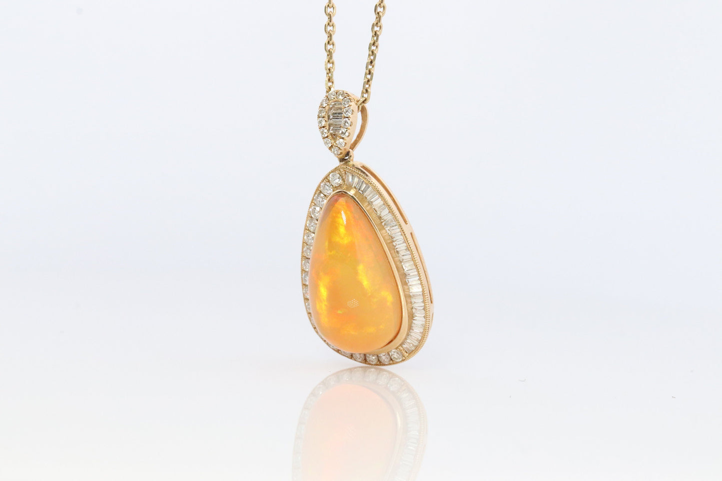 Opal and Diamond Halo 14k pendant. Large Natural Pendant Surrounded by Baguette and Round Diamonds. Pear Opal Cabochon. Appraised.