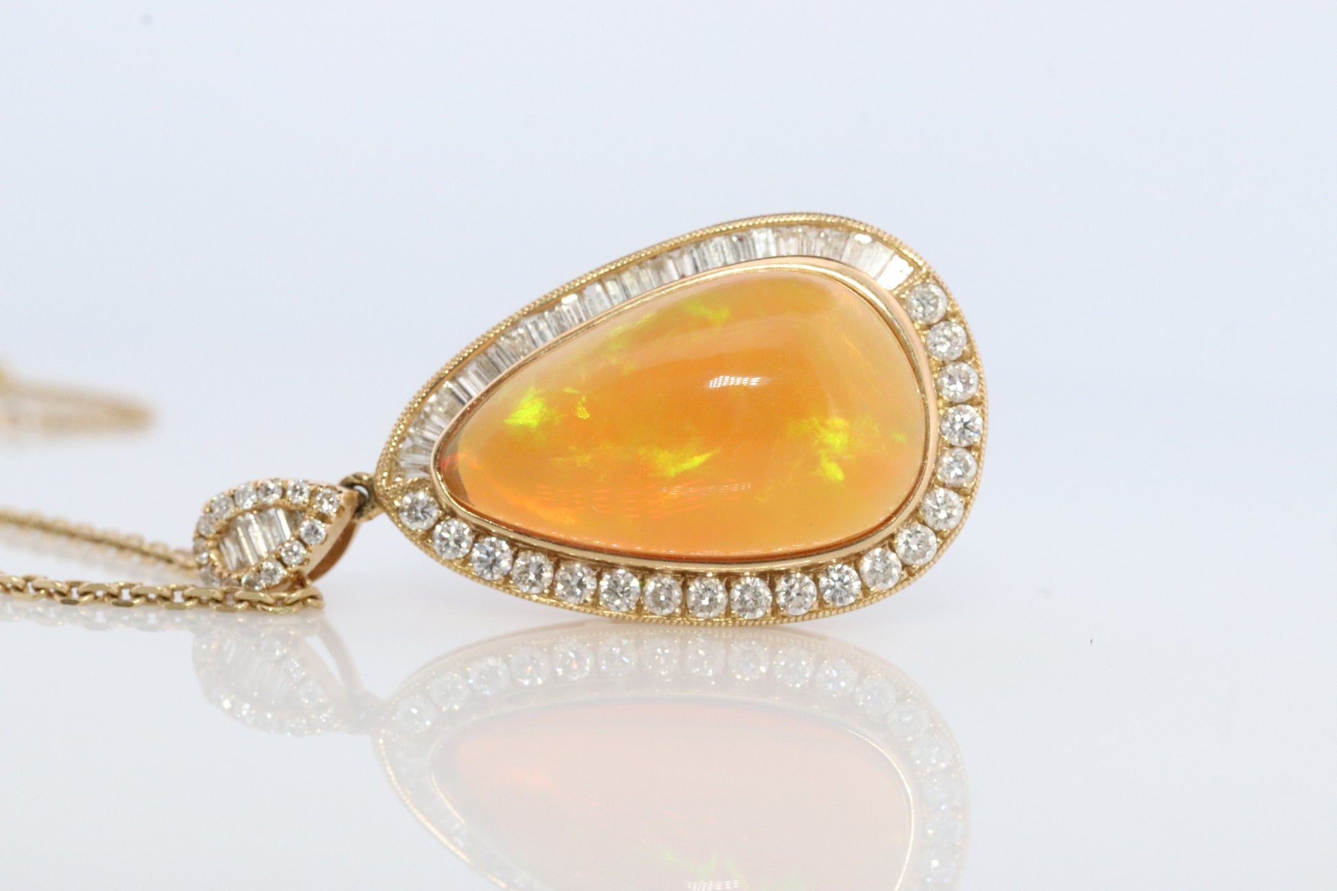 Opal and Diamond Halo 14k pendant. Large Natural Pendant Surrounded by Baguette and Round Diamonds. Pear Opal Cabochon. Appraised.