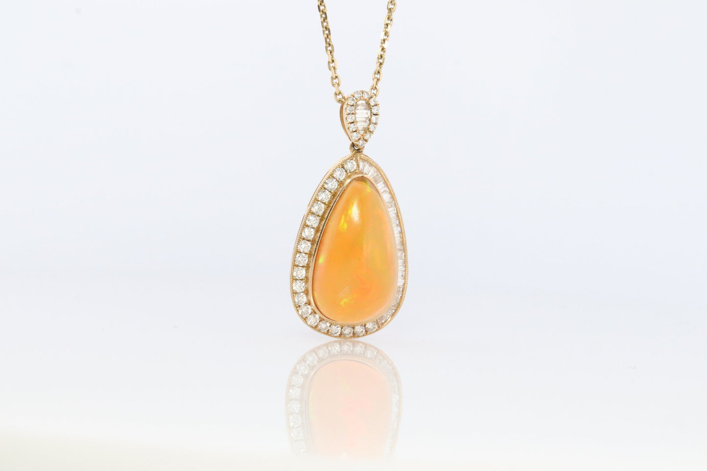 Opal and Diamond Halo 14k pendant. Large Natural Pendant Surrounded by Baguette and Round Diamonds. Pear Opal Cabochon. Appraised.