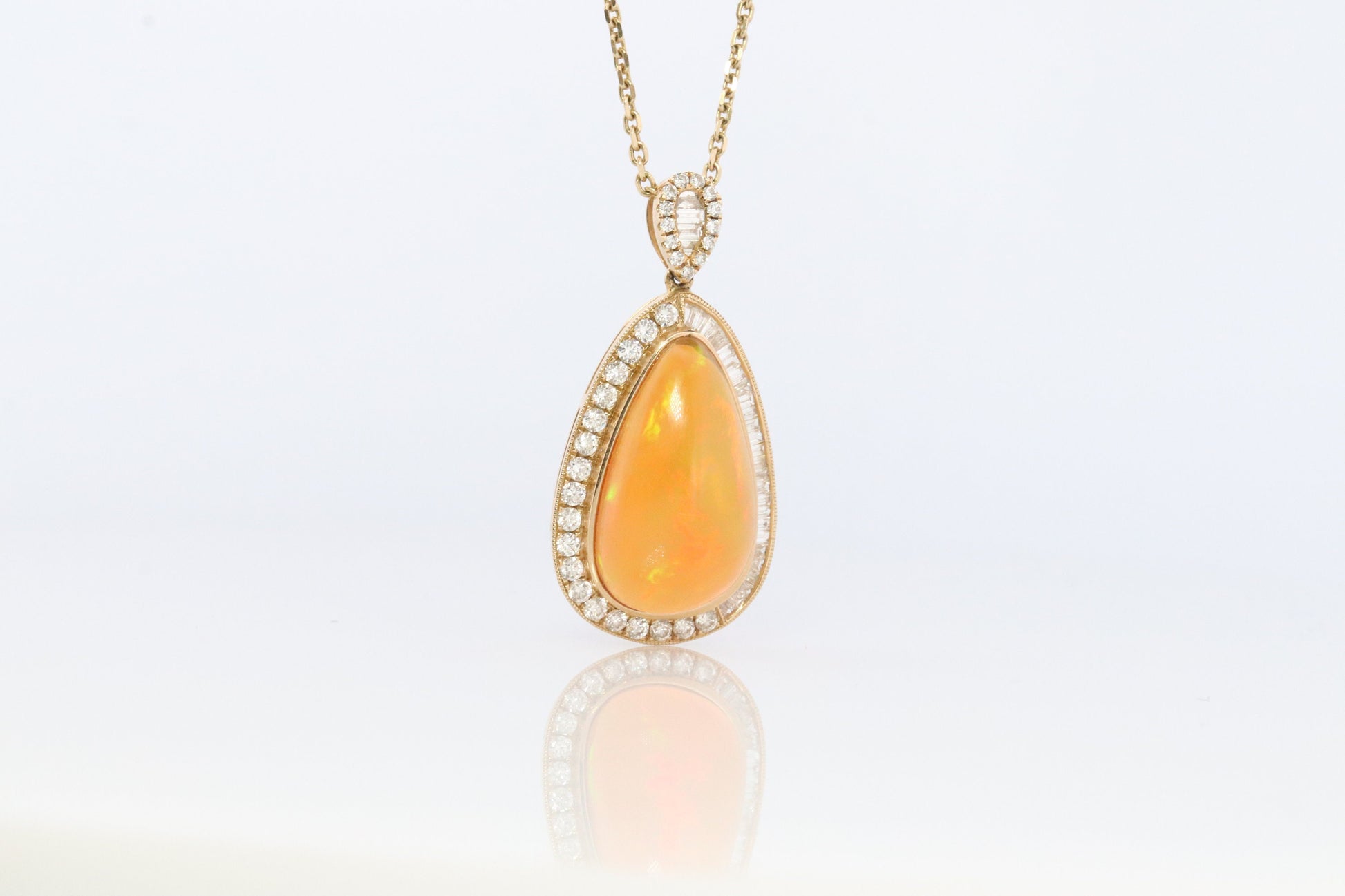 Opal and Diamond Halo 14k pendant. Large Natural Pendant Surrounded by Baguette and Round Diamonds. Pear Opal Cabochon. Appraised.