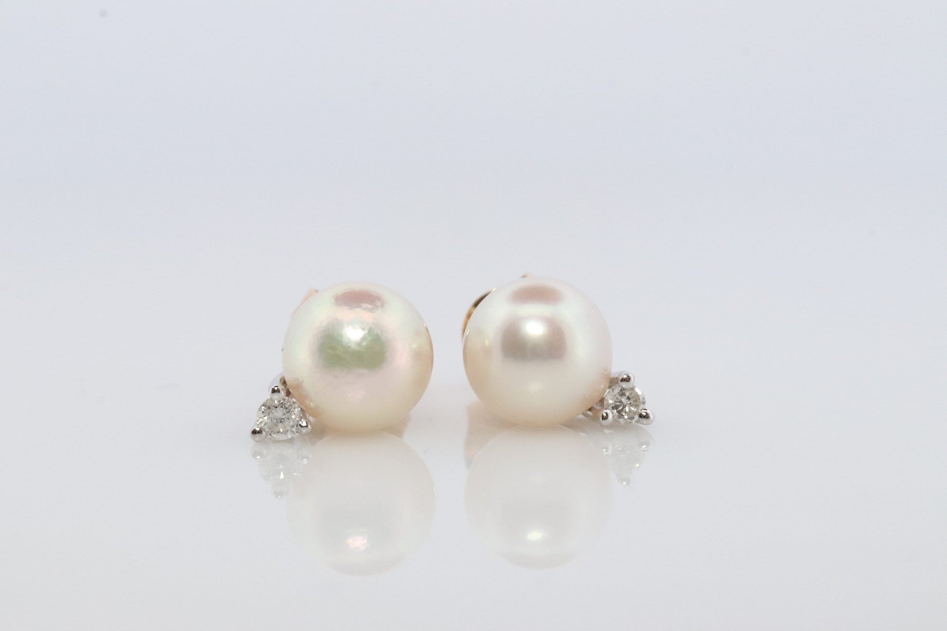 14k Pearl and Diamond stud earrings. Elegant and Dainty Pearl diamond studs.