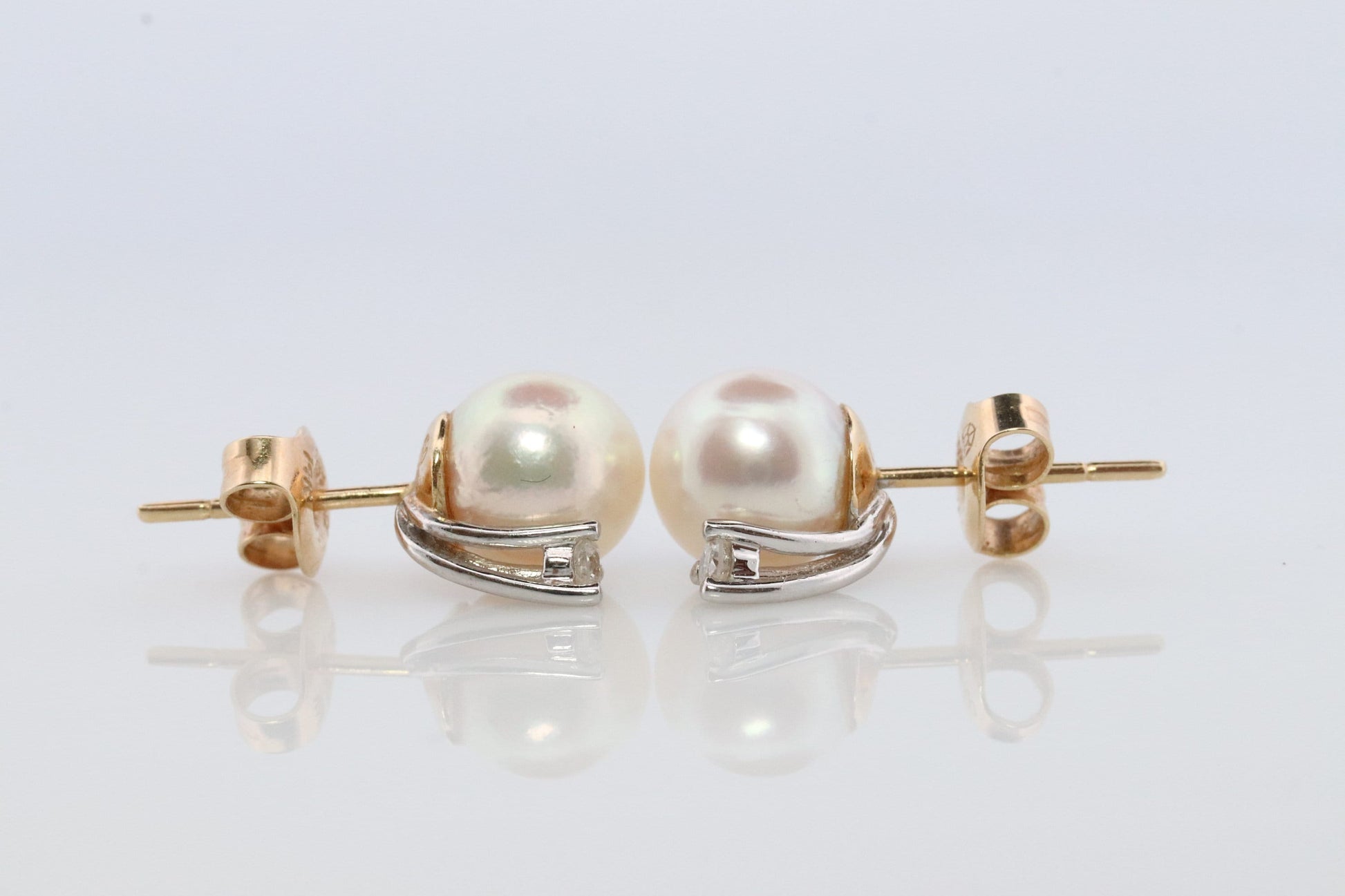 14k Pearl and Diamond stud earrings. Elegant and Dainty Pearl diamond studs.