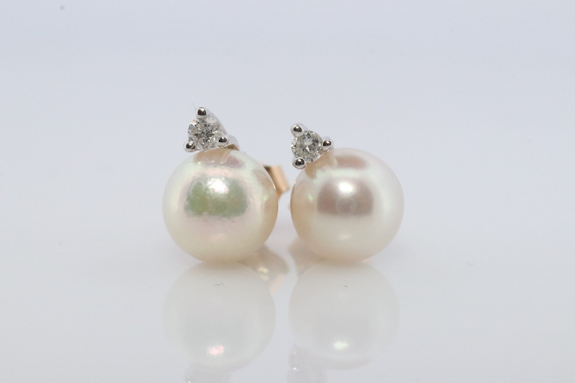 14k Pearl and Diamond stud earrings. Elegant and Dainty Pearl diamond studs.