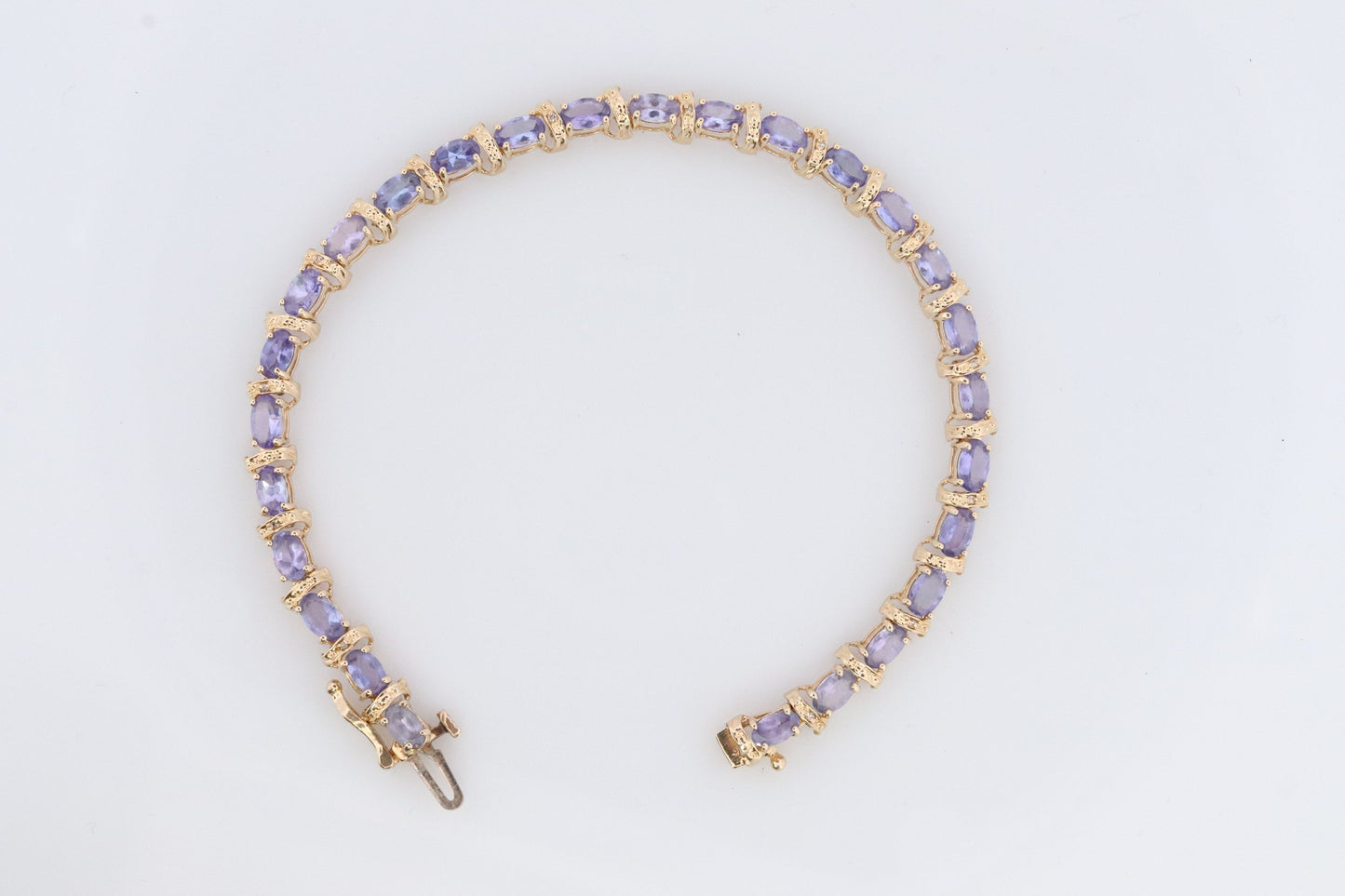 14k Tanzanite Tennis Bracelet. 14k Yellow Gold oval Tanzanite Bracelet. 14k Tanzanite alternating Bracelet.