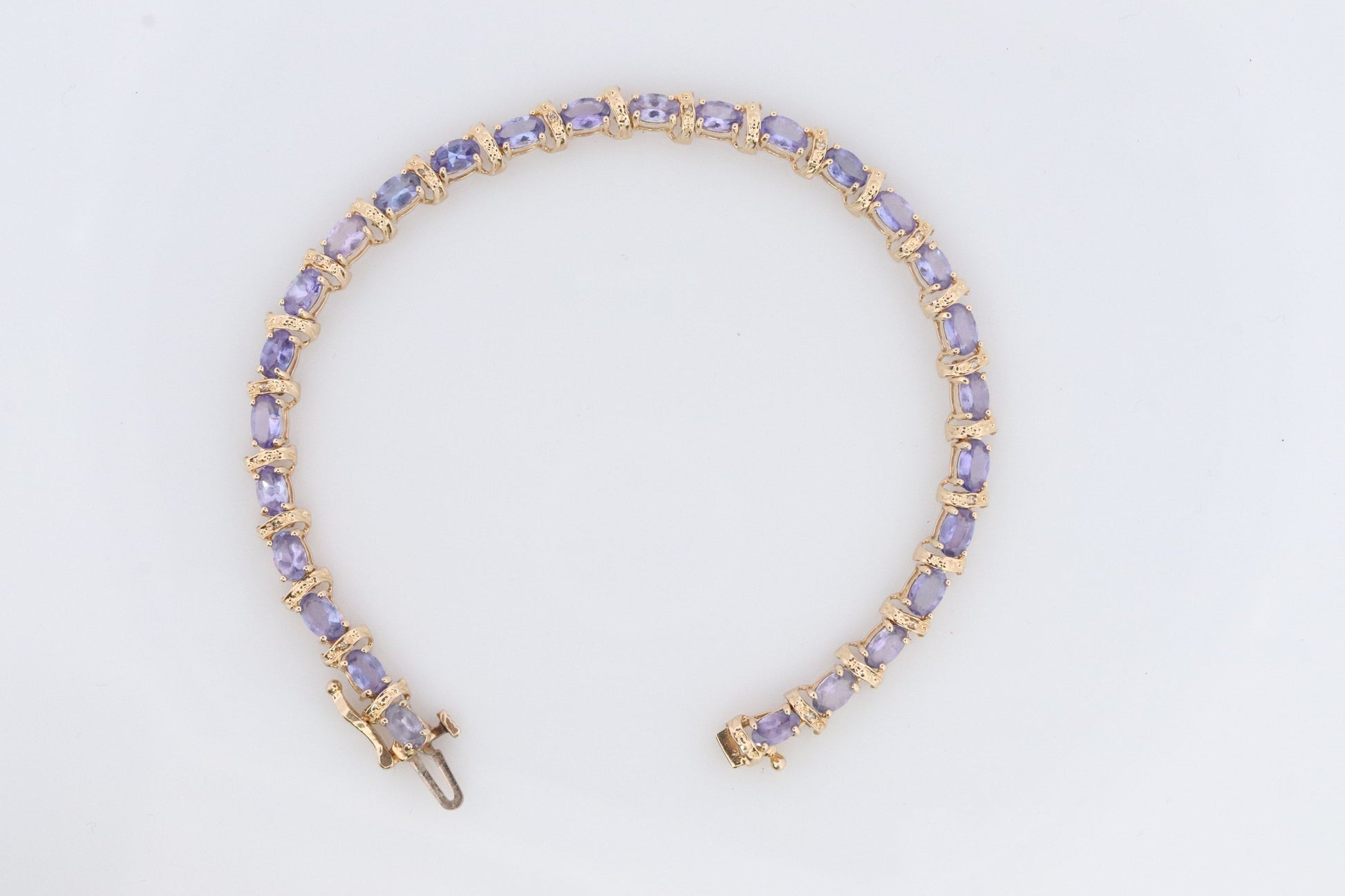 14k Tanzanite Tennis Bracelet. 14k Yellow Gold oval Tanzanite Bracelet. 14k Tanzanite alternating Bracelet.