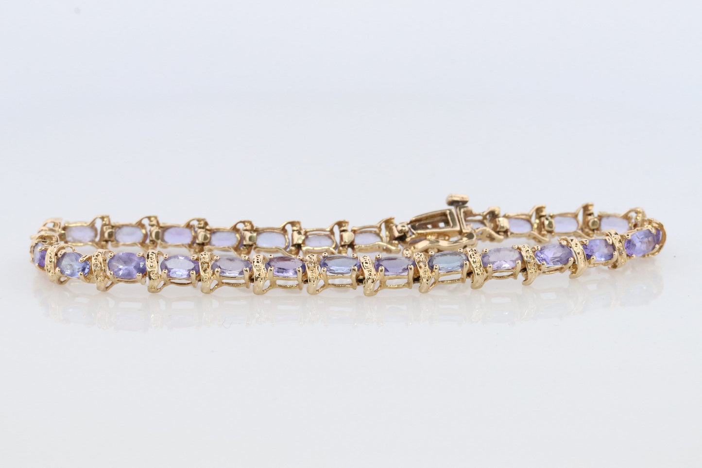 14k Tanzanite Tennis Bracelet. 14k Yellow Gold oval Tanzanite Bracelet. 14k Tanzanite alternating Bracelet.