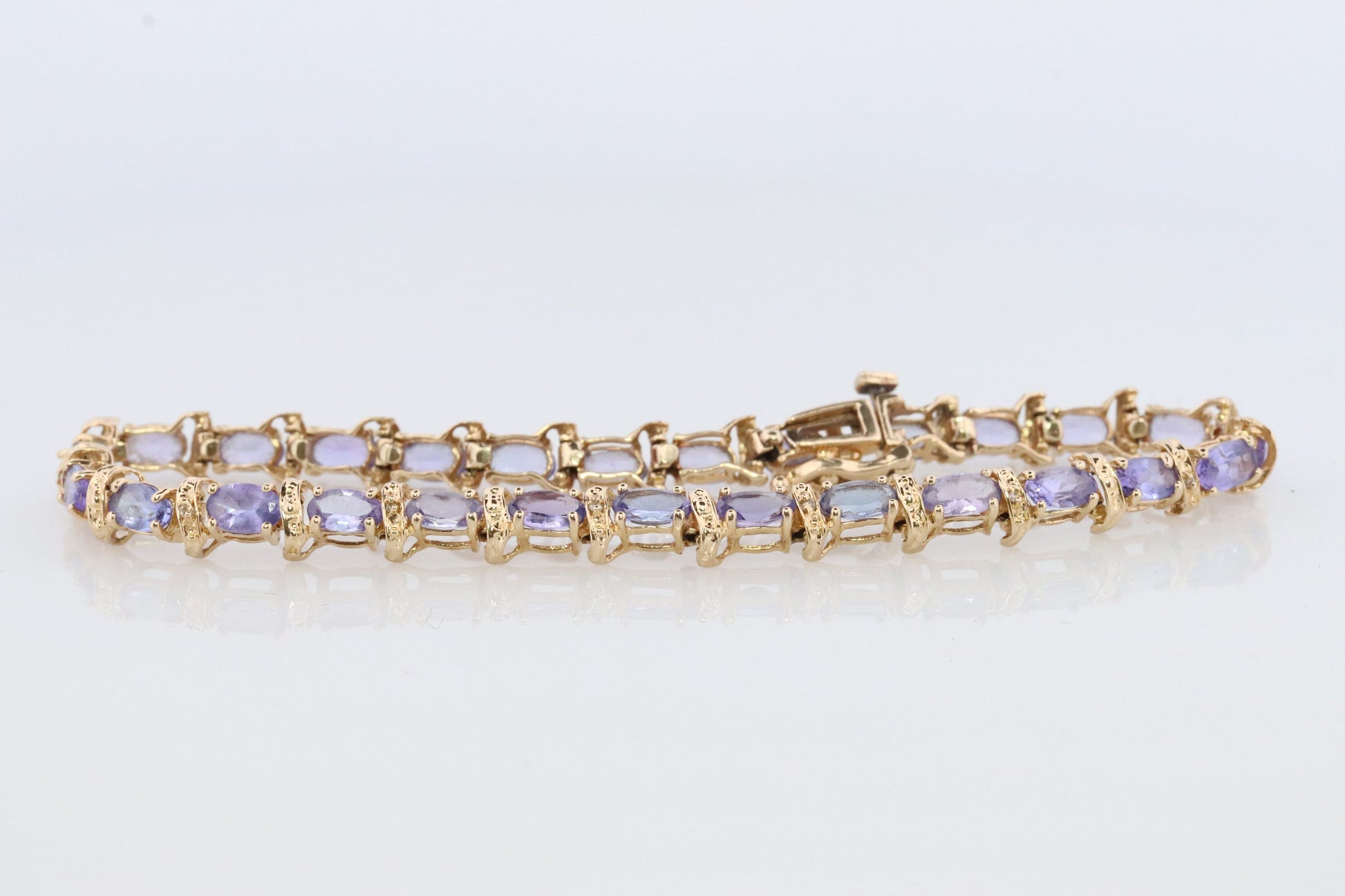 14k Tanzanite Tennis Bracelet. 14k Yellow Gold oval Tanzanite Bracelet. 14k Tanzanite alternating Bracelet.