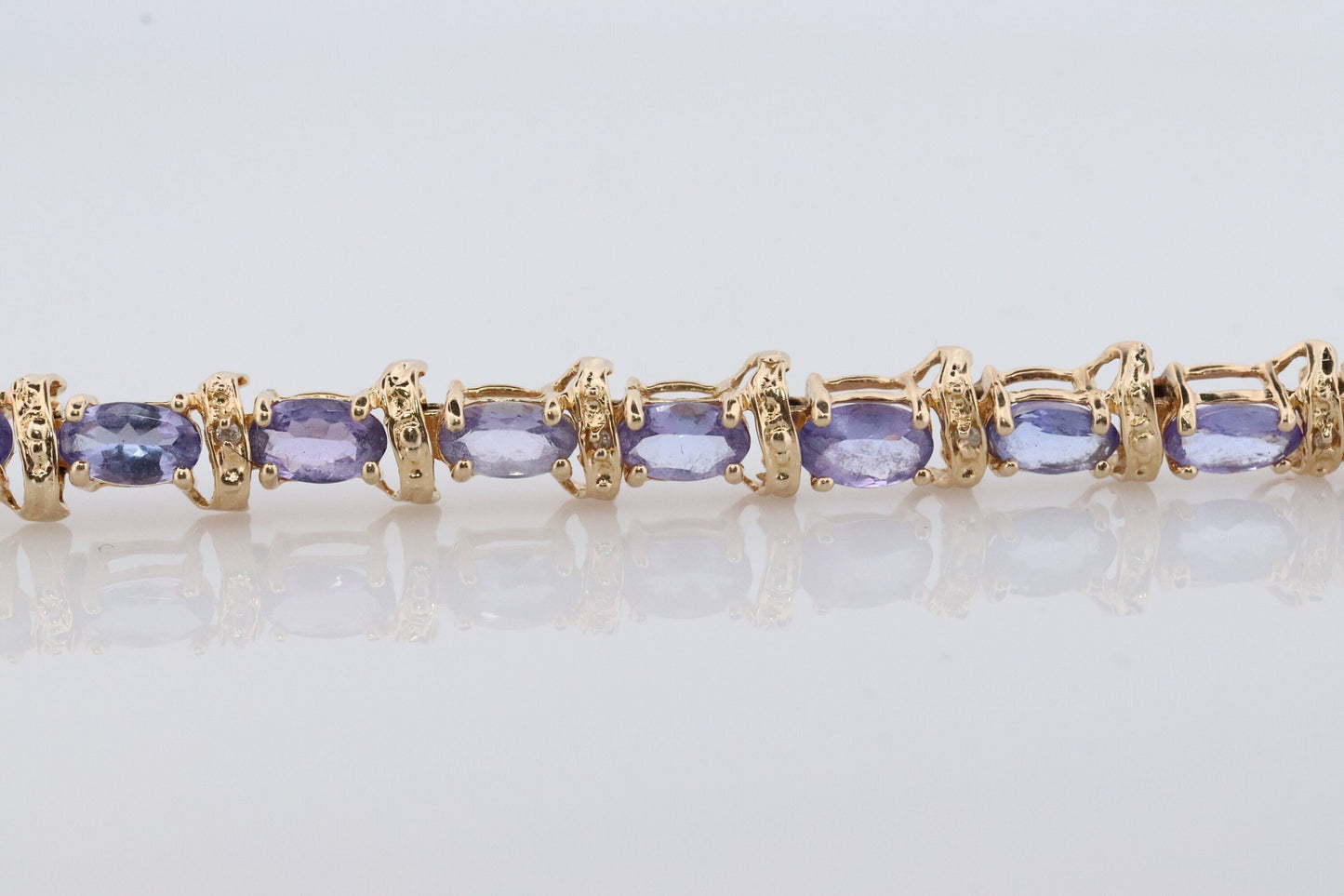14k Tanzanite Tennis Bracelet. 14k Yellow Gold oval Tanzanite Bracelet. 14k Tanzanite alternating Bracelet.