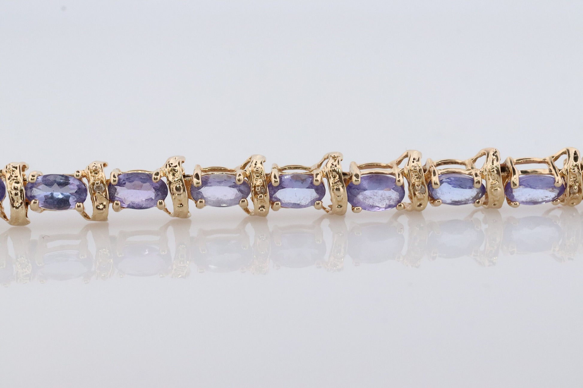 14k Tanzanite Tennis Bracelet. 14k Yellow Gold oval Tanzanite Bracelet. 14k Tanzanite alternating Bracelet.