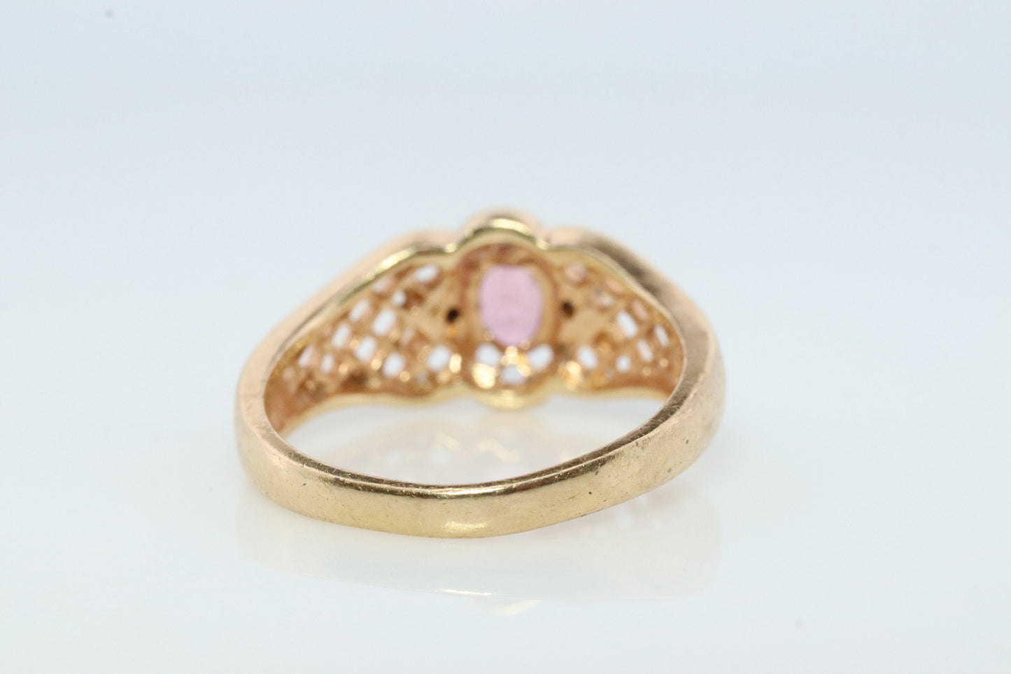 14k Pink Tourmaline Ring. prong set OVAL Tourmaline solitaire with diamond accents.