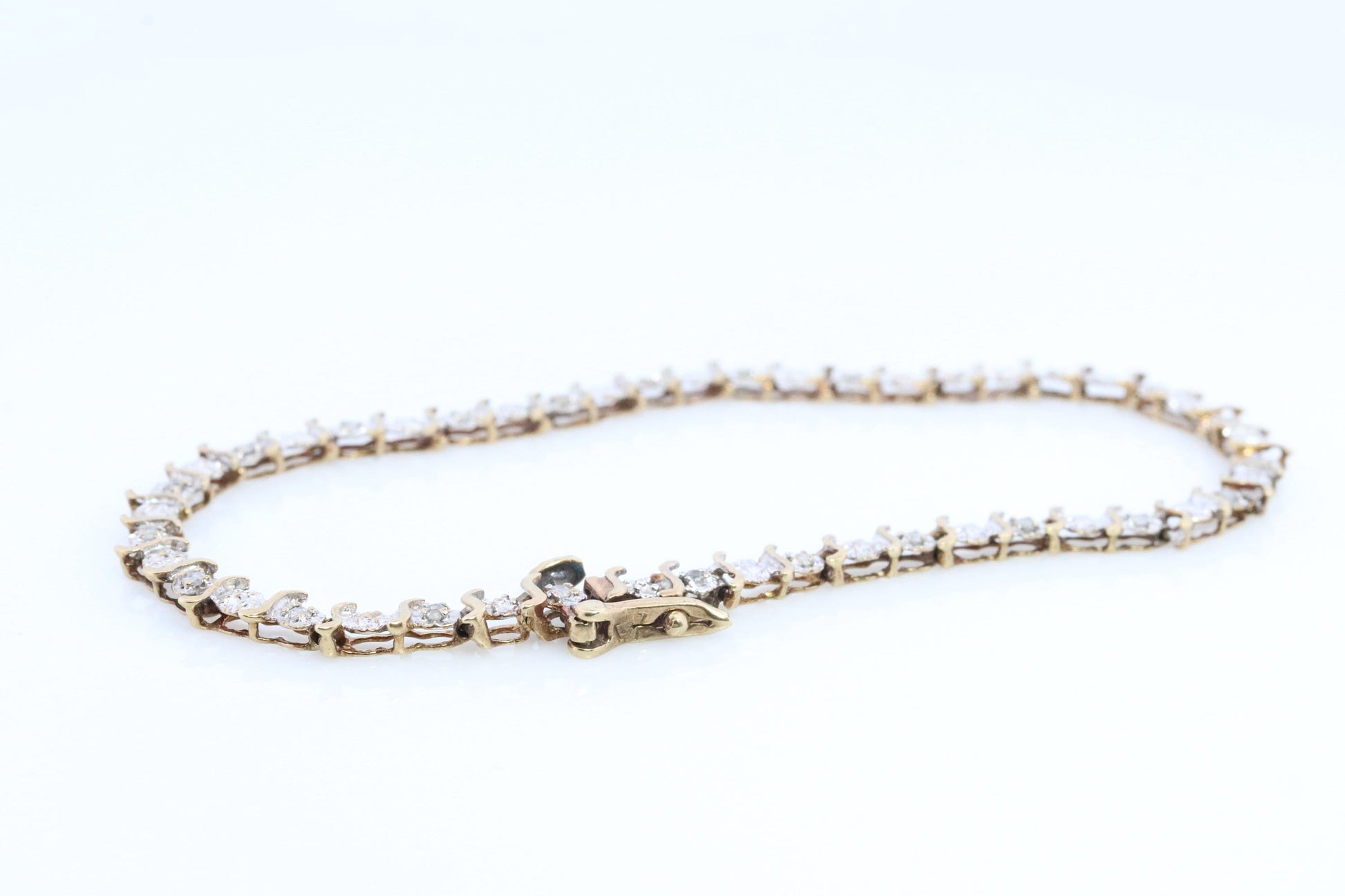 10k Diamond Tennis Bracelet. 10k S-LINK round diamond Tennis bracelet.