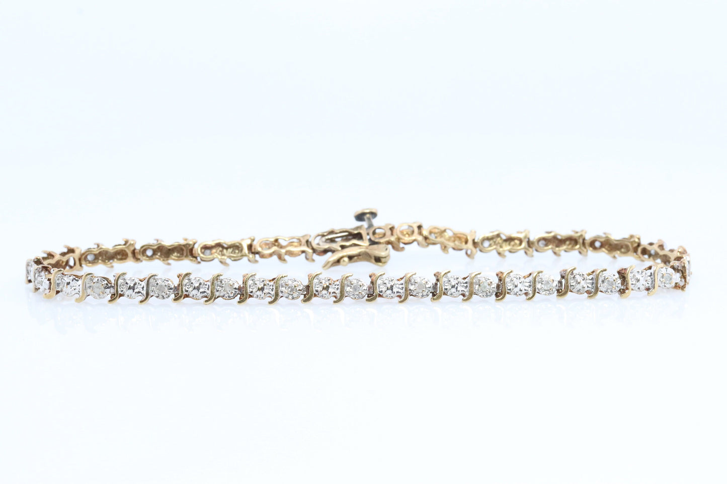 10k Diamond Tennis Bracelet. 10k S-LINK round diamond Tennis bracelet.