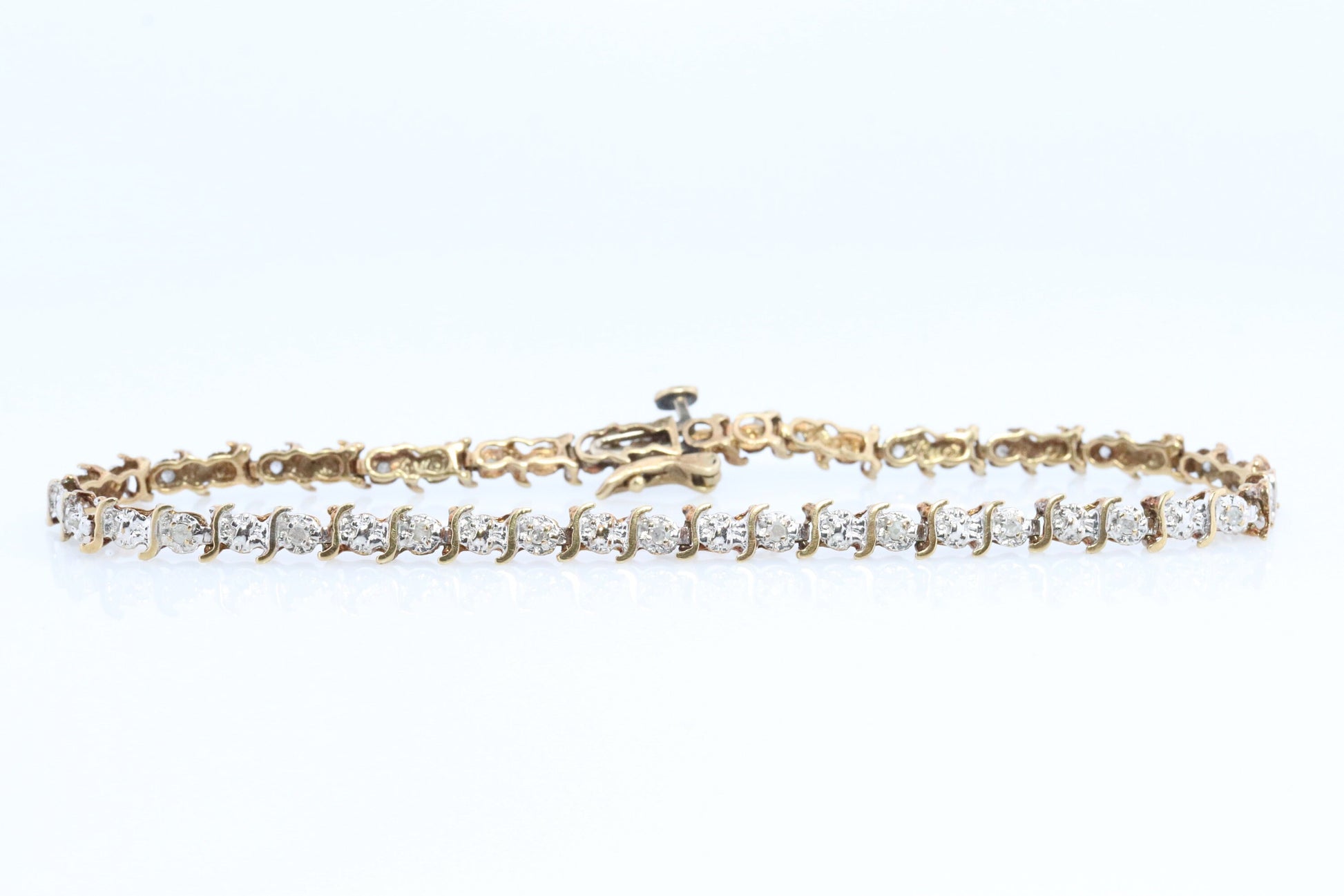 10k Diamond Tennis Bracelet. 10k S-LINK round diamond Tennis bracelet.