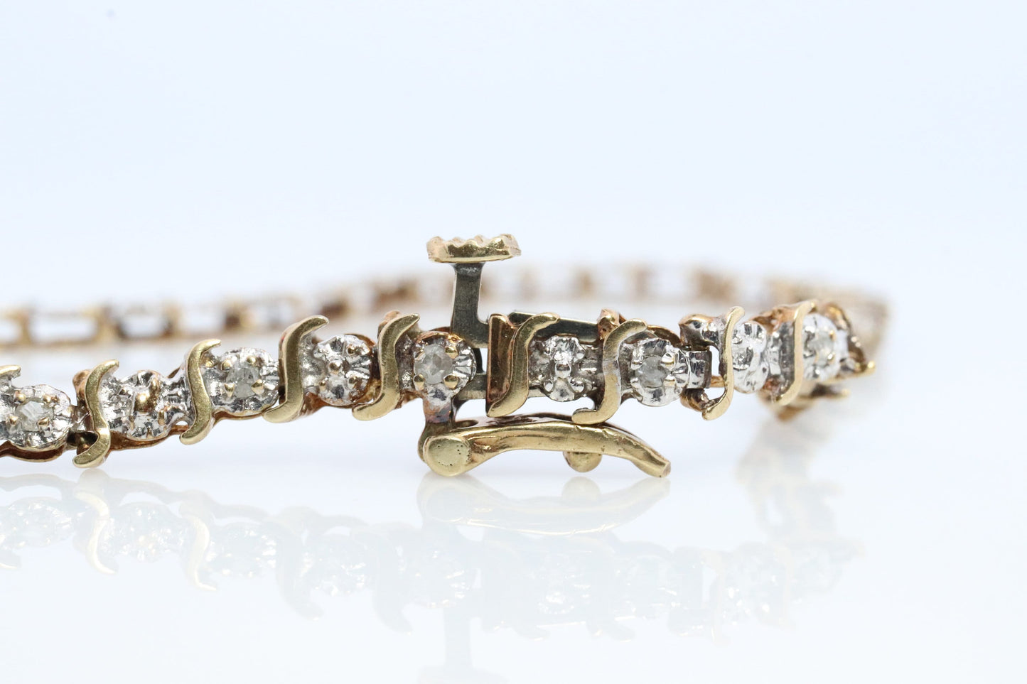10k Diamond Tennis Bracelet. 10k S-LINK round diamond Tennis bracelet.