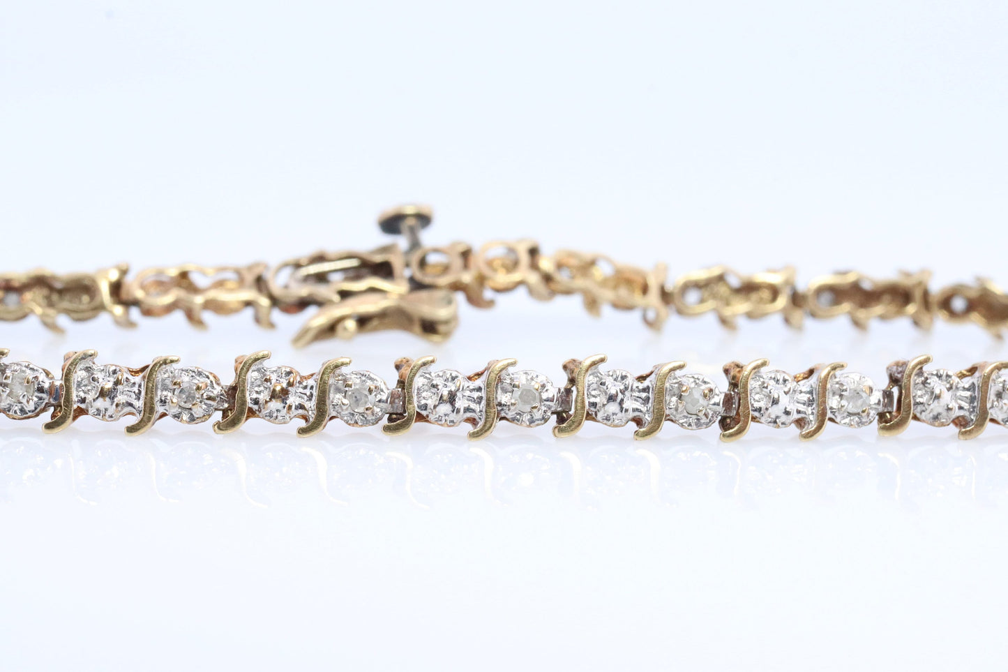 10k Diamond Tennis Bracelet. 10k S-LINK round diamond Tennis bracelet.